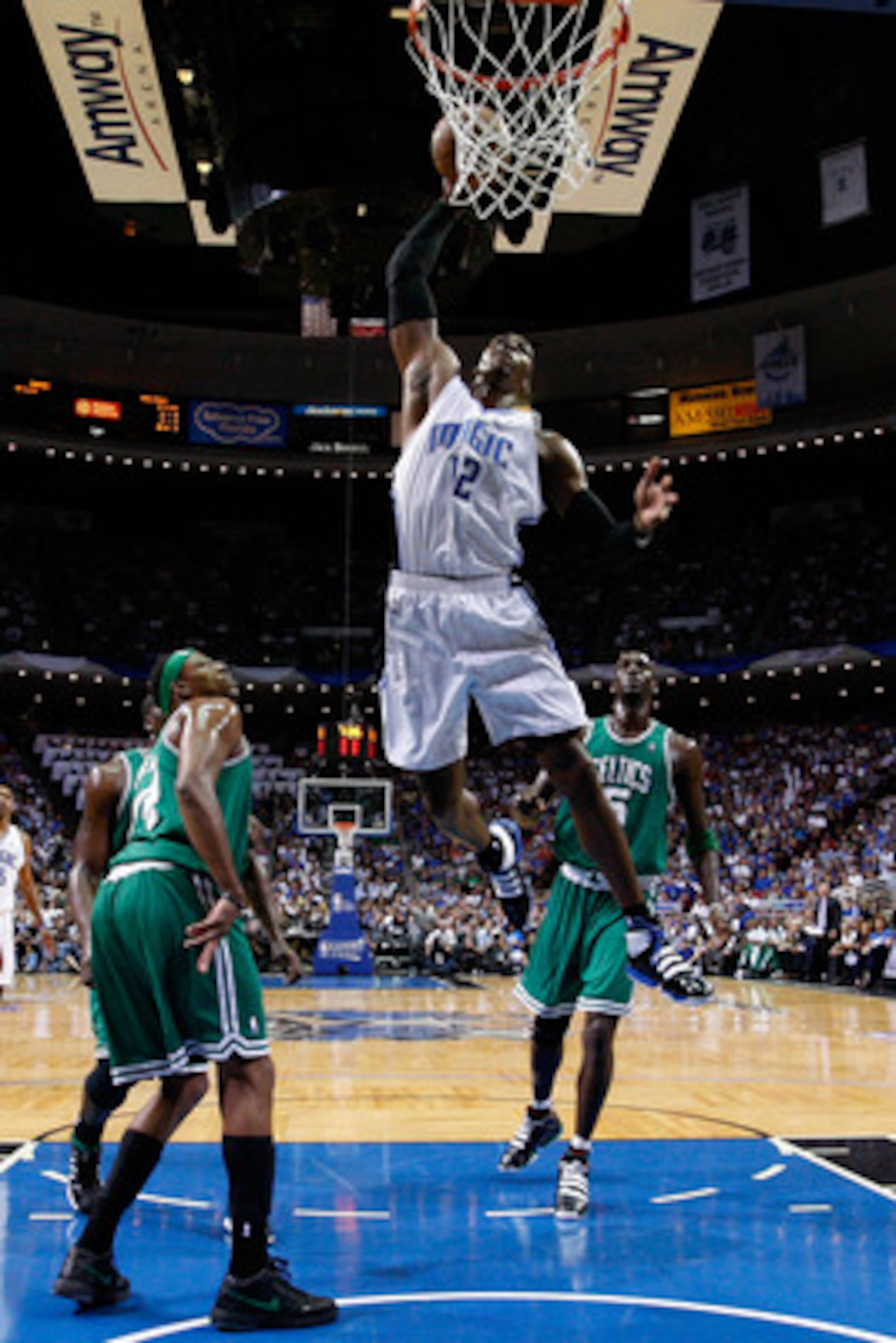 ORLANDO, FL - MAY 26:  Dwight Howard #12 of the Orlando Magic dunks against Paul Pierce #34 and Kevin Garnett #5 of the Boston Celtics in Game Five of the Eastern Conference Finals during the 2010 NBA Playoffs at Amway Arena on May 26, 2010 in Orlando, Fl