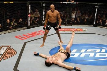 Silva stands over a beaten Forrest Griffin at UFC 101.
