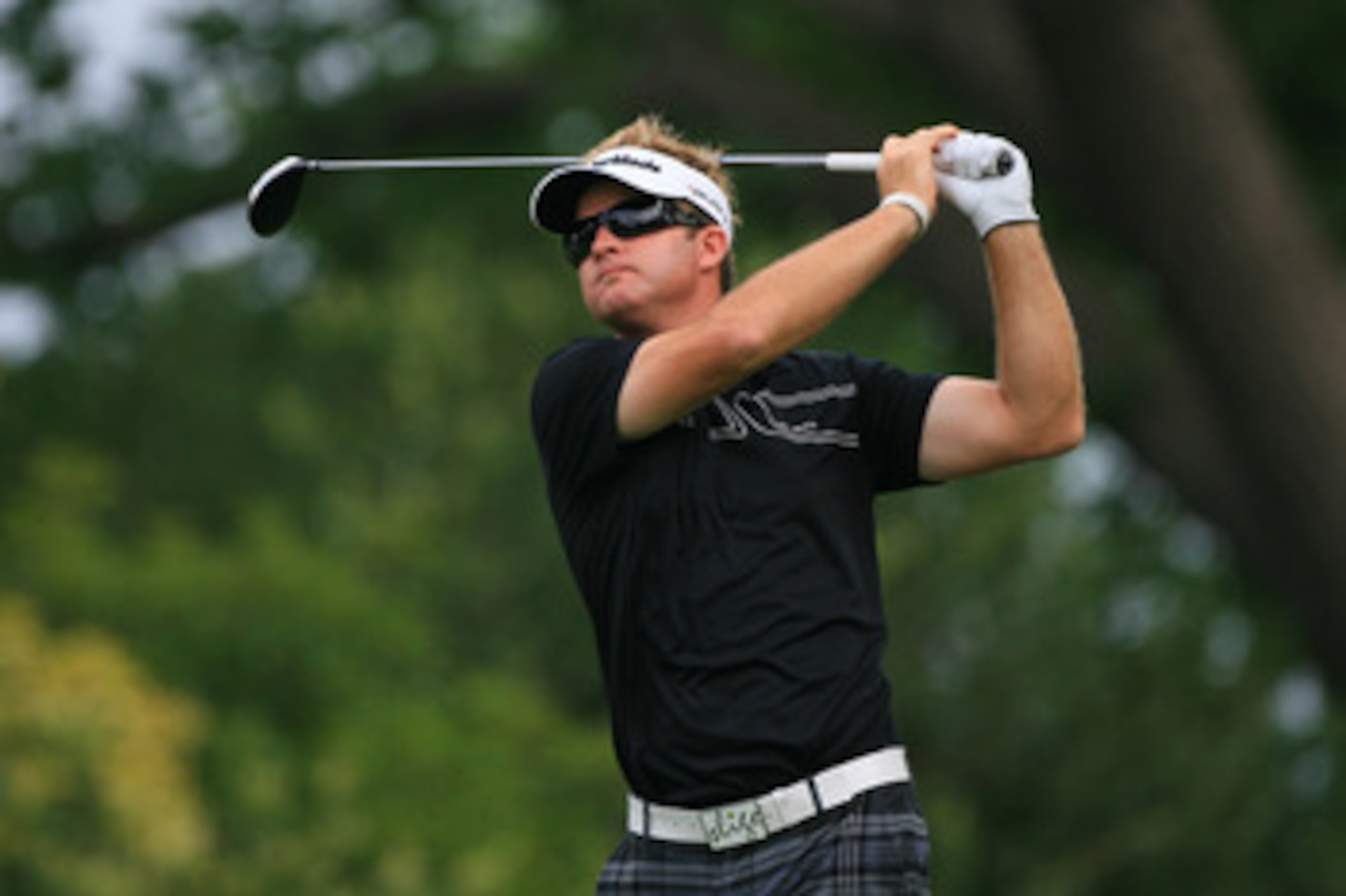 FT. WORTH, TX - MAY 19: Brian Gay hits his tee shot on the ninth hole during the first round of the Crowne Plaza Invitational at Colonial Country Club on May 19, 2011 in Ft. Worth, Texas. (Photo by Hunter Martin/Getty Images)