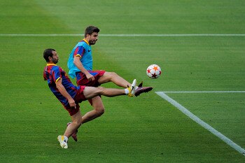 BARCELONA, SPAIN - MAY 23:  Javier Mascherano of FC Barcelona (L) and his teammate Gerard Pique duels for the ball during the FC Barcelona training session held ahead of next Saturday's UEFA Champions League Final at the Camp Nou Stadium on May 23, 2011 i