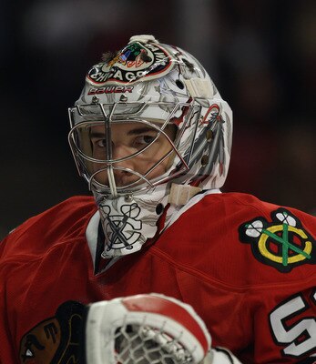 CHICAGO, IL - APRIL 10: Corey Crawford #50 of the Chicago Blackhawks rests during a break in the action against the Detroit Red Wings at the United Center on April 10, 2011 in Chicago, Illinois. The Red Wings defeated the Blackhawks 4-3. (Photo by Jonatha