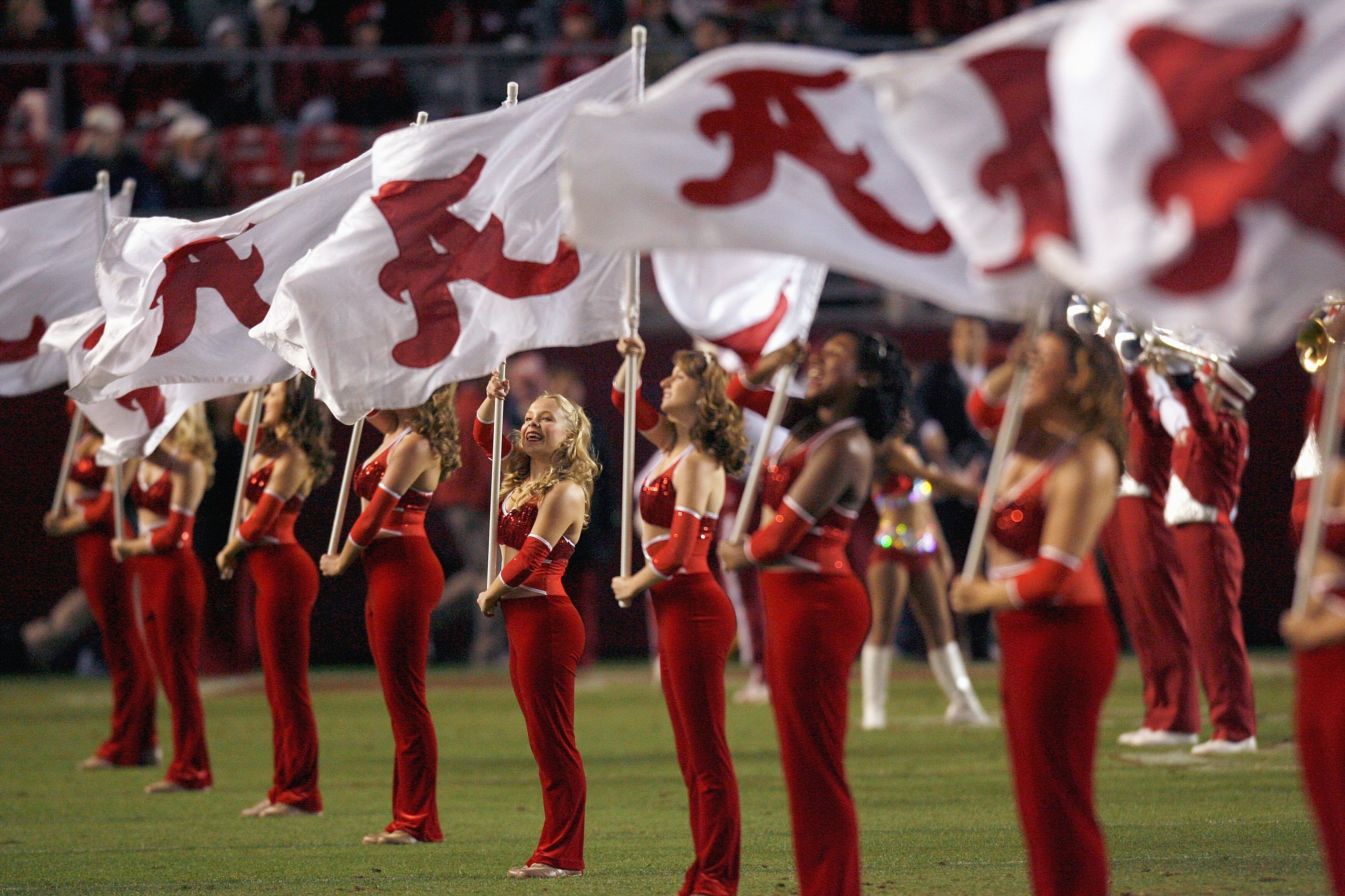 TUSCALOOSA, AL - NOVEMBER 15: The flag girls of the Alabama Crimson Tide marching band perform before the game against the Mississippi State Bulldogs at Bryant-Denny Stadium on November 15, 2008 in Tuscaloosa, Alabama. (Photo by Kevin C. Cox/Getty Images)