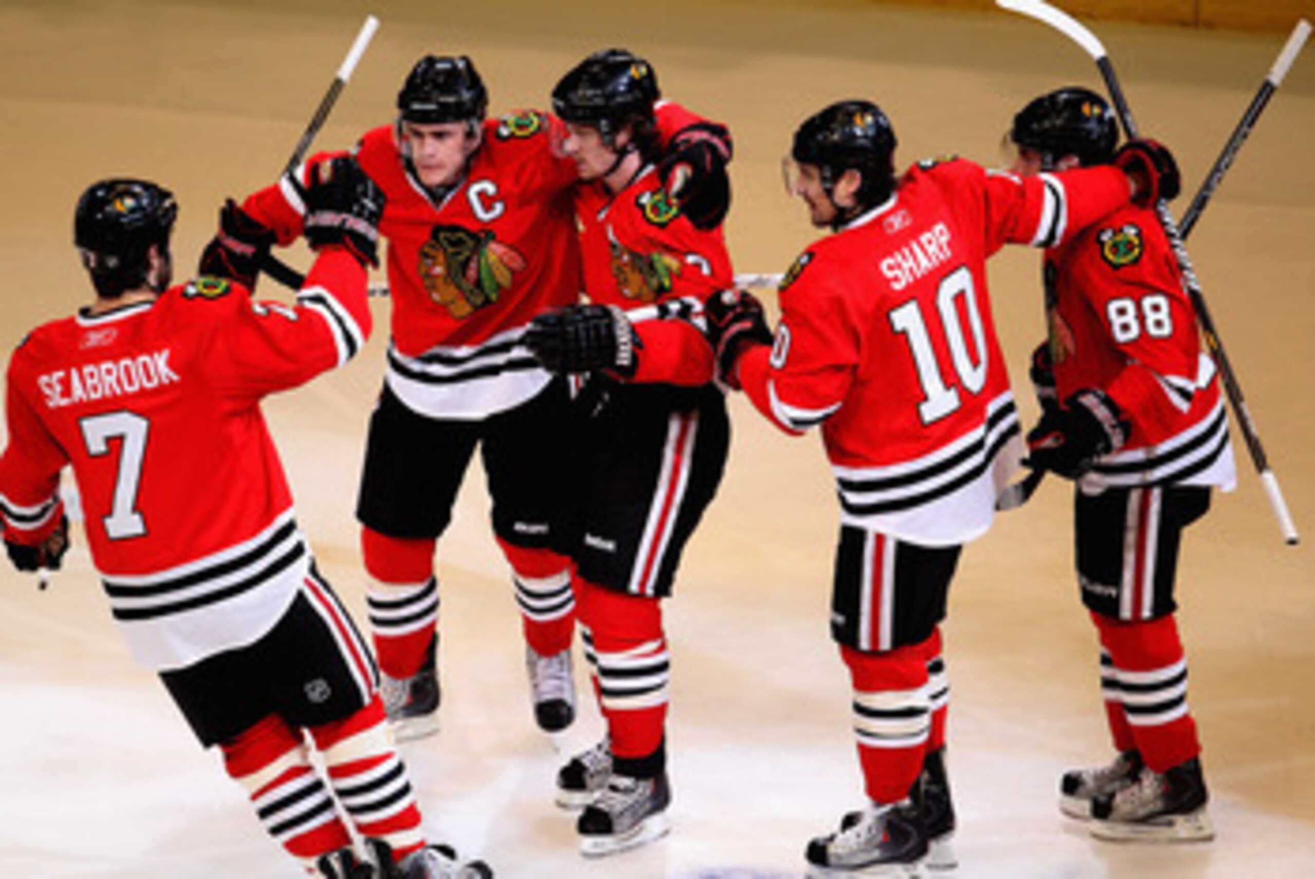 CHICAGO, IL - APRIL 17: (L-R) Brent Seabrook #7, Jonathan Toews #19, Duncan Keith #2, Patrick Sharp #10 and Patrick Kane #88 of the Chicago Blackhawks celebrate Keith's 1st period power-play goal against the Vancouver Canucks in Game Three of the Western 