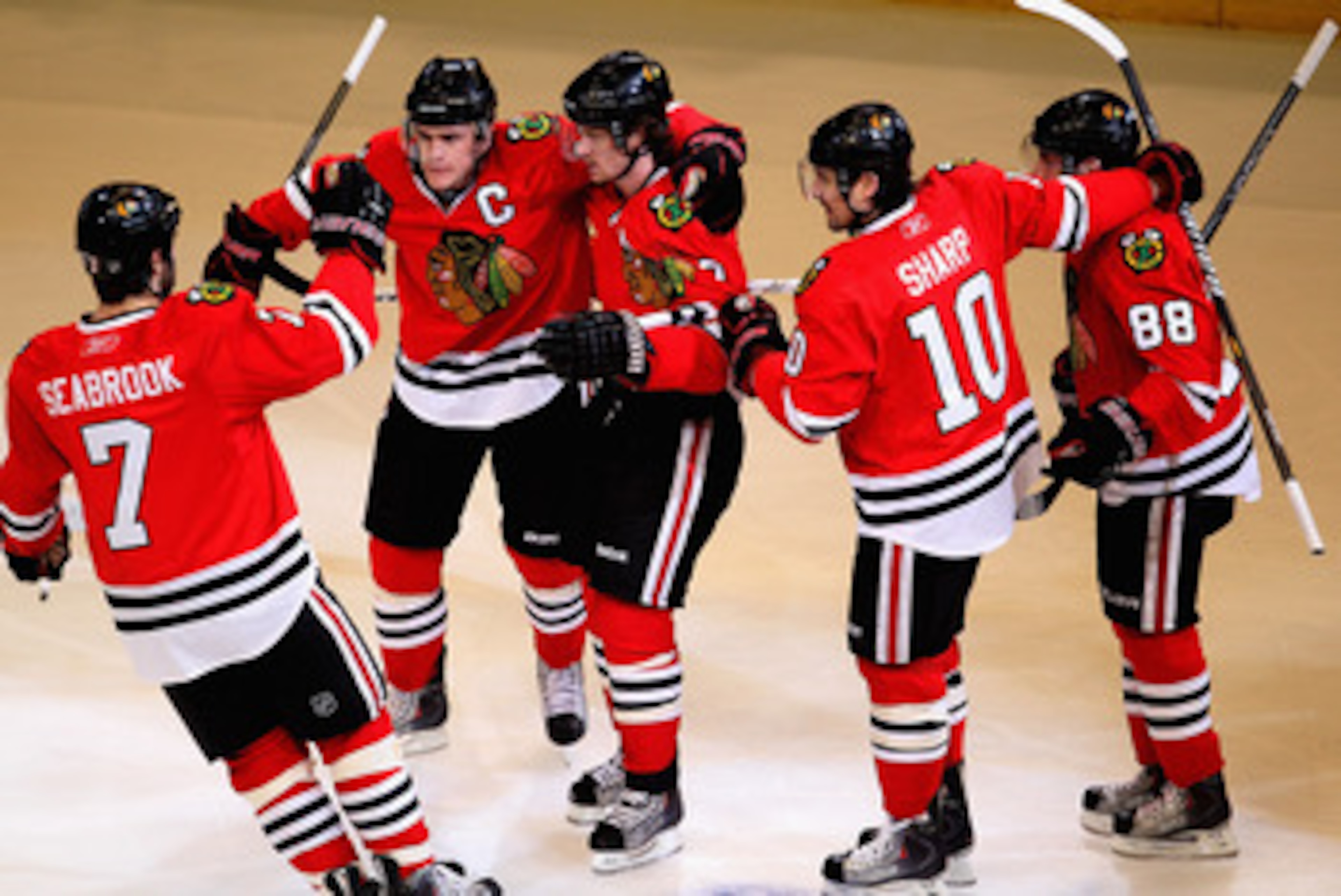 CHICAGO, IL - APRIL 17: (L-R) Brent Seabrook #7, Jonathan Toews #19, Duncan Keith #2, Patrick Sharp #10 and Patrick Kane #88 of the Chicago Blackhawks celebrate Keith's 1st period power-play goal against the Vancouver Canucks in Game Three of the Western 