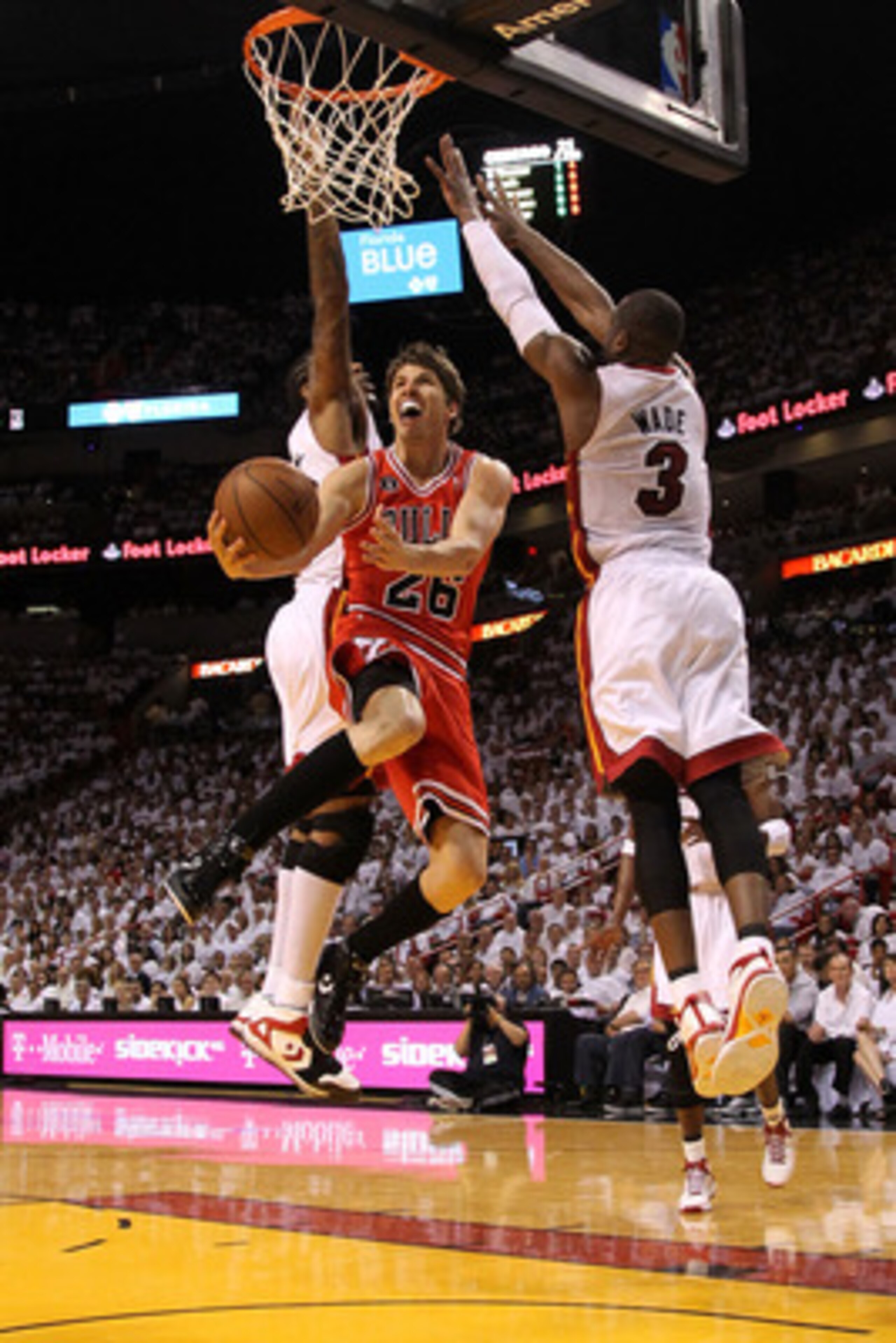 MIAMI, FL - MAY 22:  Kyle Korver #26 of the Chicago Bulls drives for a shot attempt against Dwyane Wade #3 of the Miami Heat in Game Three of the Eastern Conference Finals during the 2011 NBA Playoffs on May 22, 2011 at American Airlines Arena in Miami, F