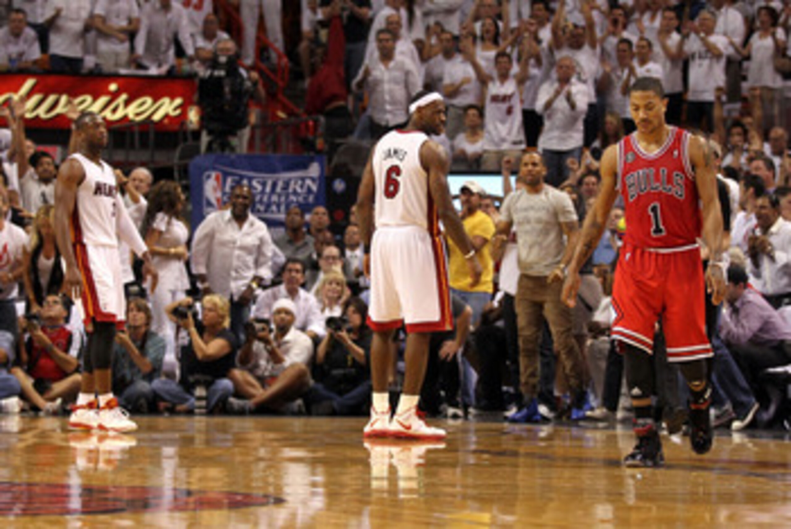 MIAMI, FL - MAY 24: Derrick Rose #1 of the Chicago Bulls walks up court as LeBron James #6 (C) and Dwyane Wade #3 of the Miami Heat look on in Game Four of the Eastern Conference Finals during the 2011 NBA Playoffs on May 24, 2011 at American Airlines Are