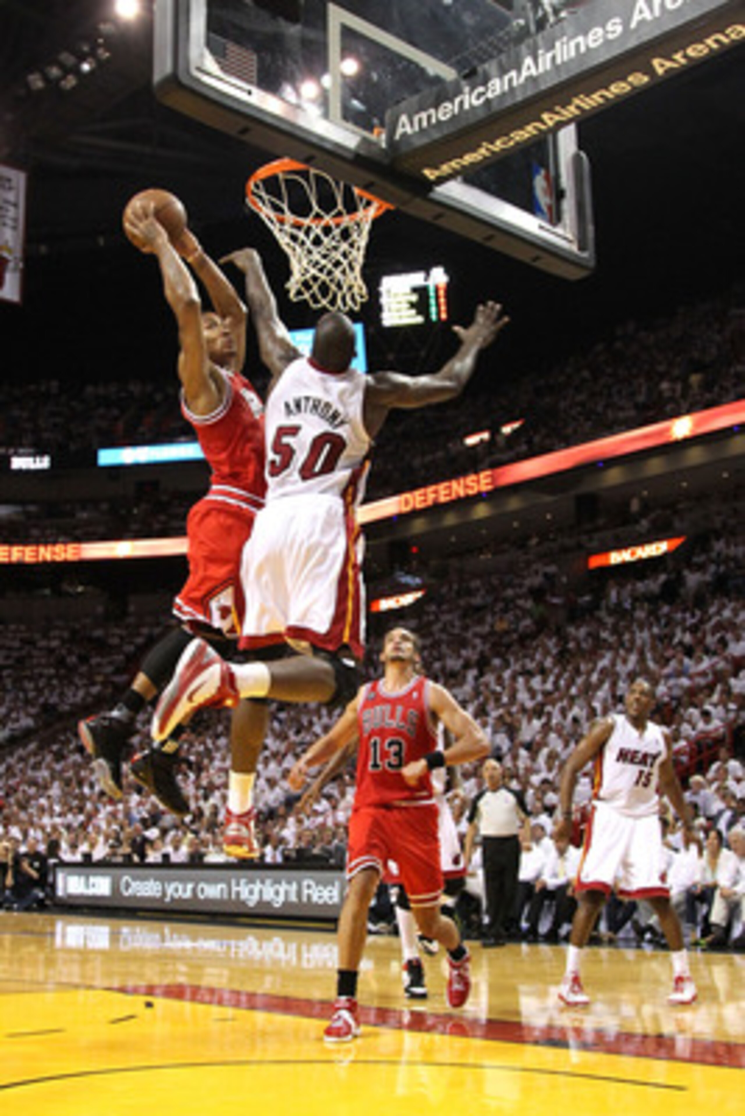 MIAMI, FL - MAY 24:  Derrick Rose #1 of the Chicago Bulls dunks on Joel Anthony #50 of the Miami Heat in the first half of Game Four of the Eastern Conference Finals during the 2011 NBA Playoffs on May 24, 2011 at American Airlines Arena in Miami, Florida