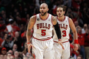 CHICAGO, IL - MAY 15:  Carlos Boozer #5 and Joakim Noah #13 of the Chicago Bulls react against the Miami Heat in Game One of the Eastern Conference Finals during the 2011 NBA Playoffs on May 15, 2011 at the United Center in Chicago, Illinois. NOTE TO USER