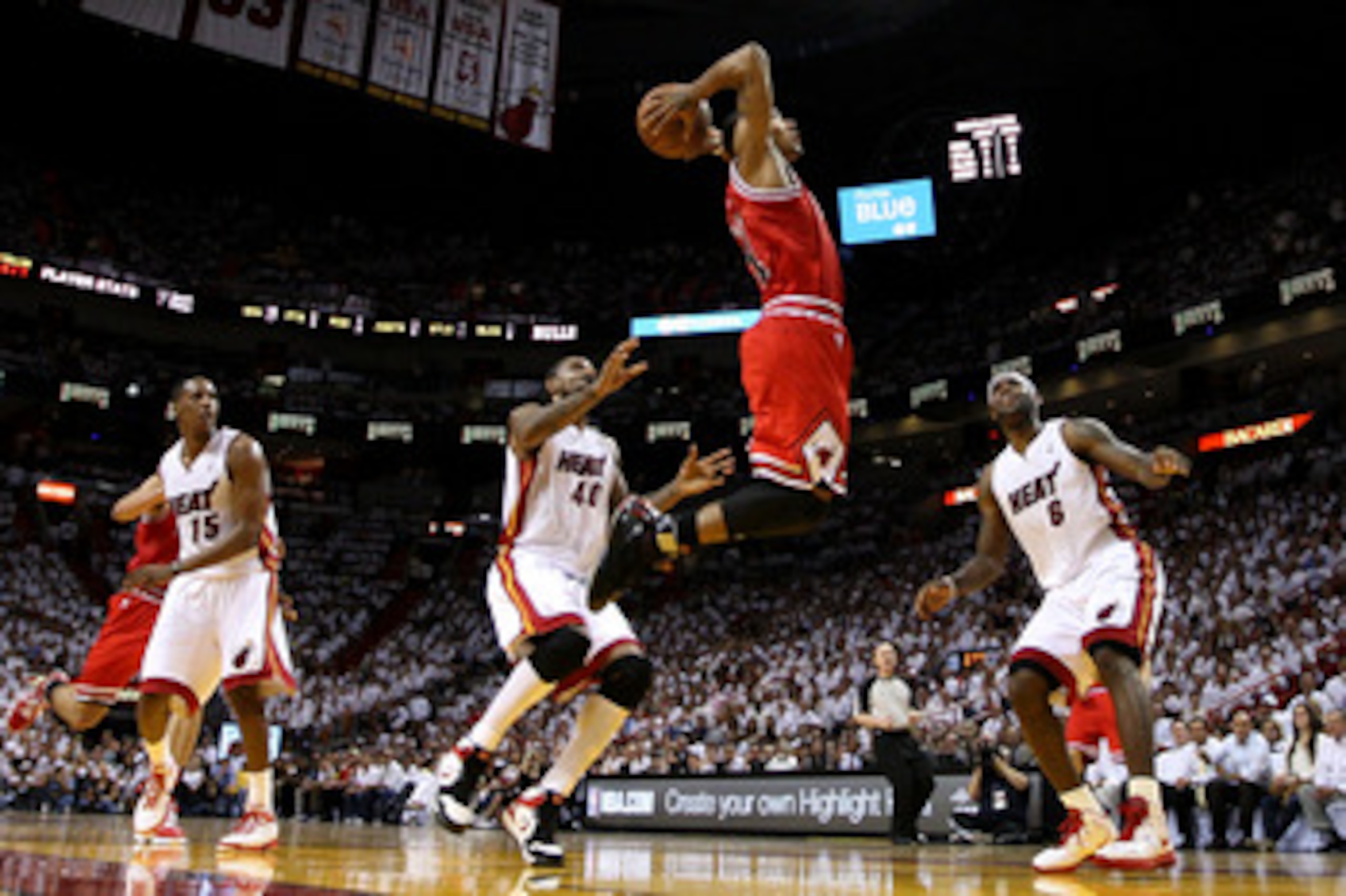 MIAMI, FL - MAY 24:  Derrick Rose #1 of the Chicago Bulls goes up for a dunk against Mario Chalmers #15, Udonis Haslem #40 and LeBron James #6 of the Miami Heat in the first half of Game Four of the Eastern Conference Finals during the 2011 NBA Playoffs o
