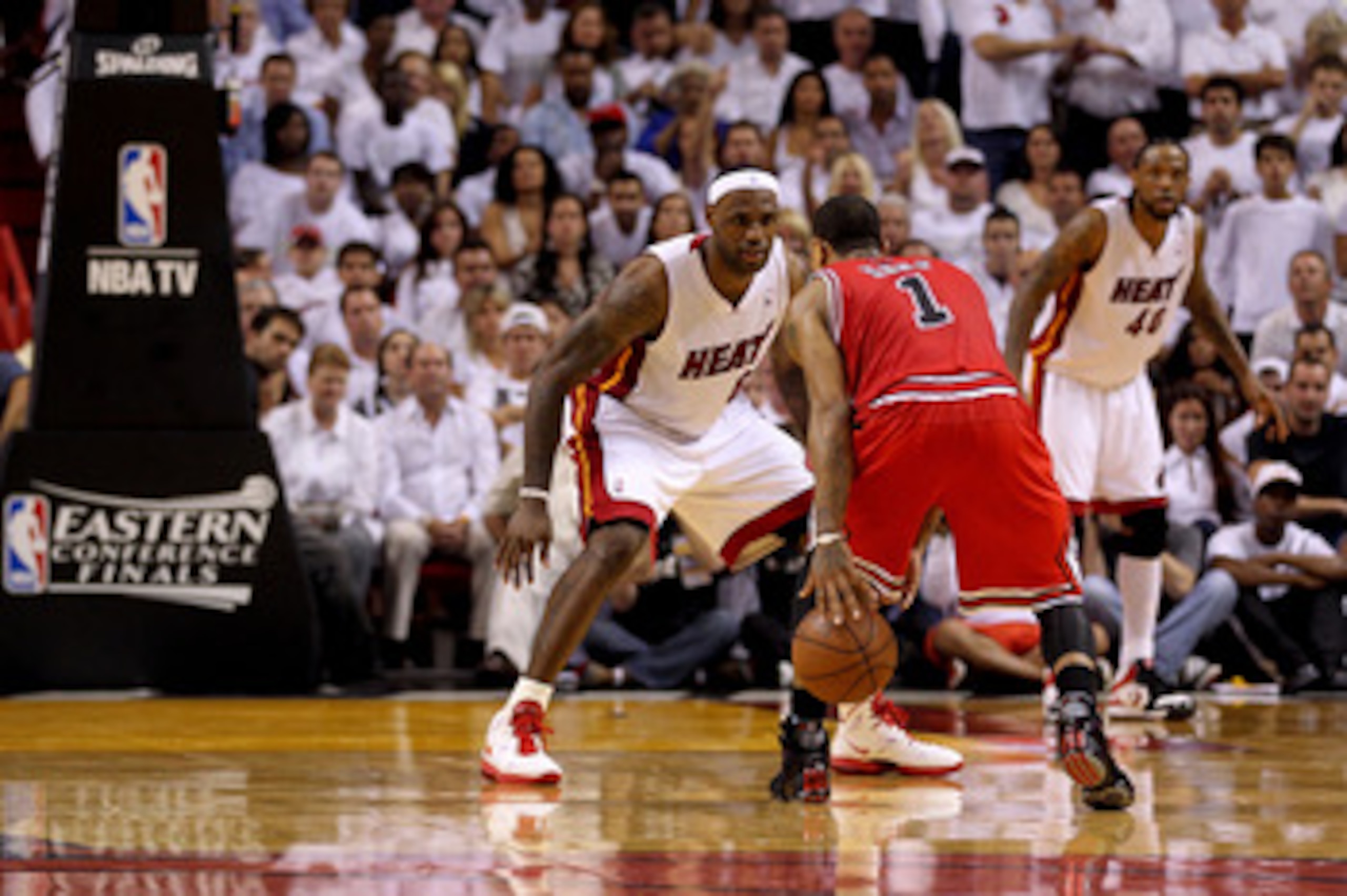 MIAMI, FL - MAY 24:  LeBron James #6 of the Miami Heat defends Derrick Rose #1 of the Chicago Bulls in Game Four of the Eastern Conference Finals during the 2011 NBA Playoffs on May 24, 2011 at American Airlines Arena in Miami, Florida. The Heat won 101-9