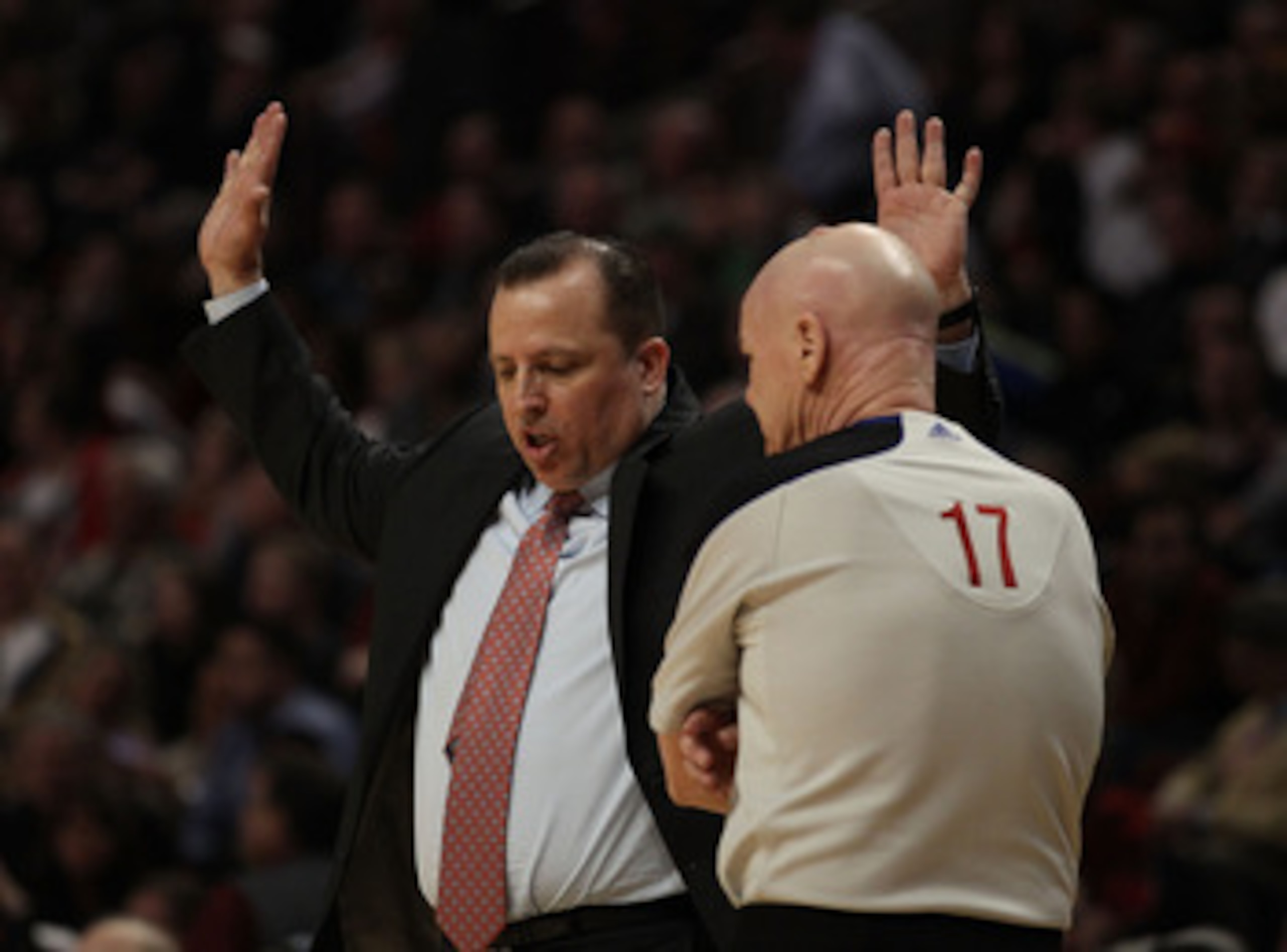CHICAGO, IL - MARCH 25: Head coach Tom Thibodeau of the Chicago Bulls aruges a play called  by referee Joey Crawford #17 during a game against the Memphis Grizzlies at the United Center on March 25, 2011 in Chicago, Illinois. The Bulls defeated the Grizzl