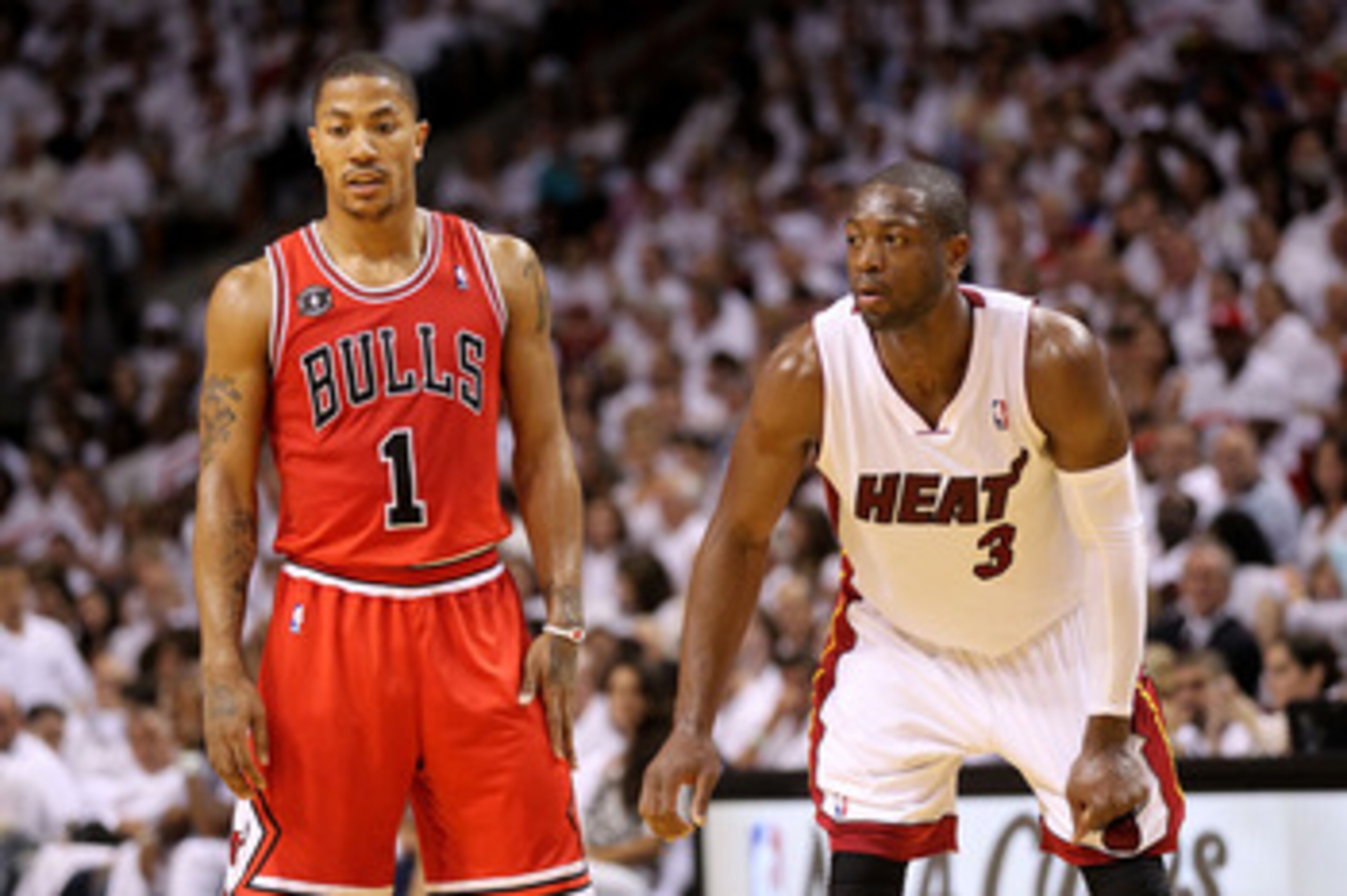 MIAMI, FL - MAY 22: Derrick Rose #1 of the Chicago Bulls and Dwyane Wade #3 of the Miami Heat look on in Game Three of the Eastern Conference Finals during the 2011 NBA Playoffs on May 22, 2011 at American Airlines Arena in Miami, Florida. NOTE TO USER: MIAMI, FL - MAY 22: Derrick Rose #1 of the Chicago Bulls and Dwyane Wade #3 of the Miami Heat look on in Game Three of the Eastern Conference Finals during the 2011 NBA Playoffs on May 22, 2011 at American Airlines Arena in Miami, Florida. NOTE TO USER: