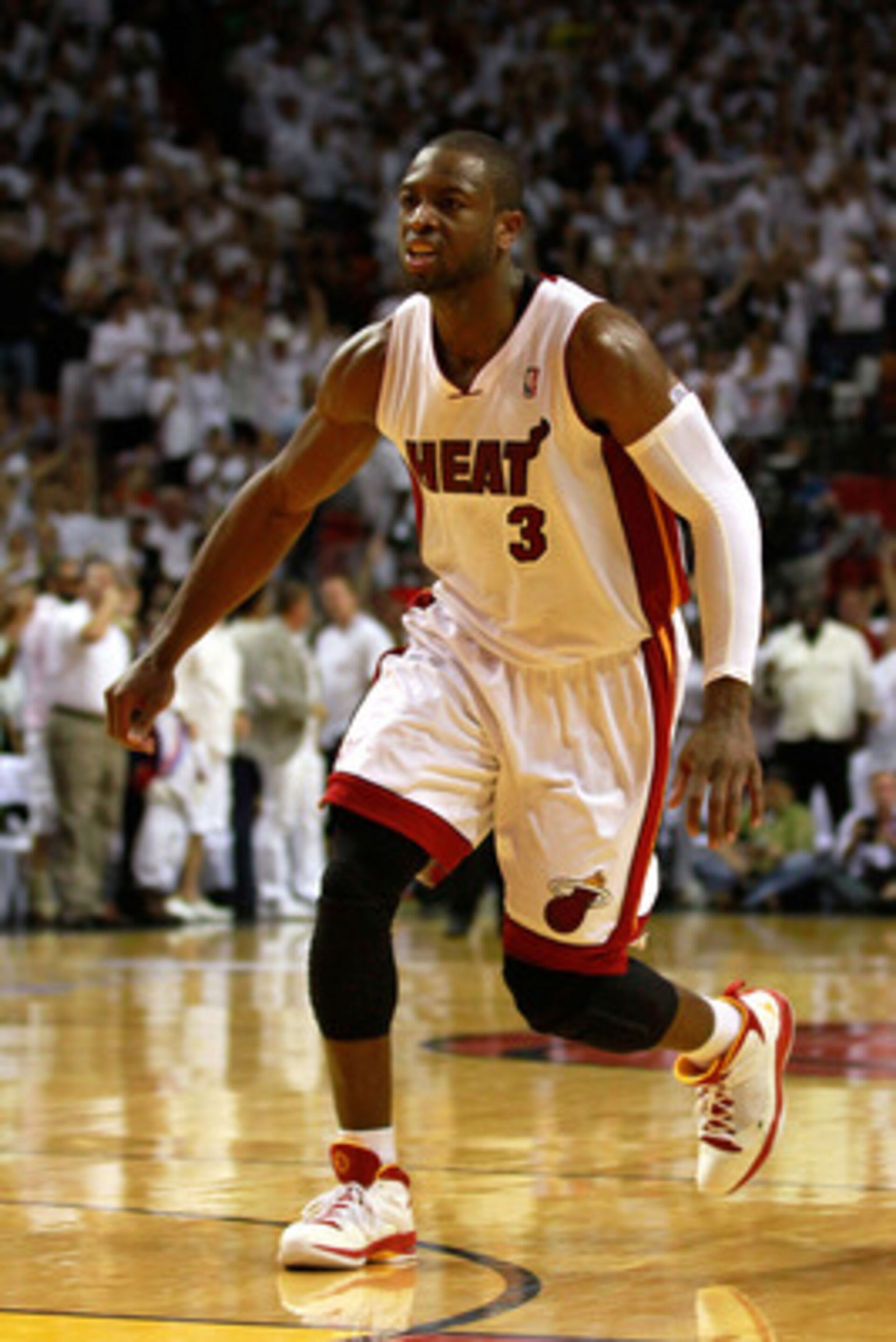 MIAMI, FL - MAY 24:  Dwyane Wade #3 of the Miami Heat reacts against the Chicago Bulls in Game Four of the Eastern Conference Finals during the 2011 NBA Playoffs on May 24, 2011 at American Airlines Arena in Miami, Florida. Recording artist Drake NOTE TO