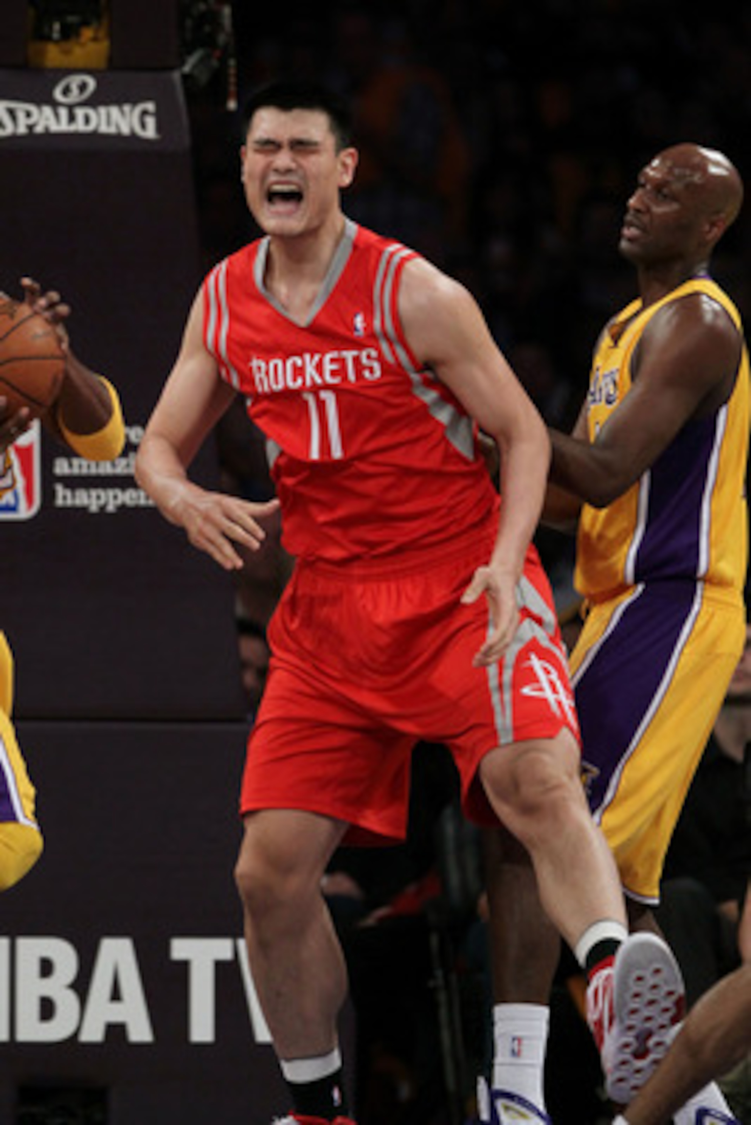 LOS ANGELES, CA - OCTOBER 26:  Yao Ming #11 of the Houston Rockets reacts to a play during their opening night game against the Los Angeles Lakers at Staples Center on October 26, 2010 in Los Angeles, California. NOTE TO USER: User expressly acknowledges 