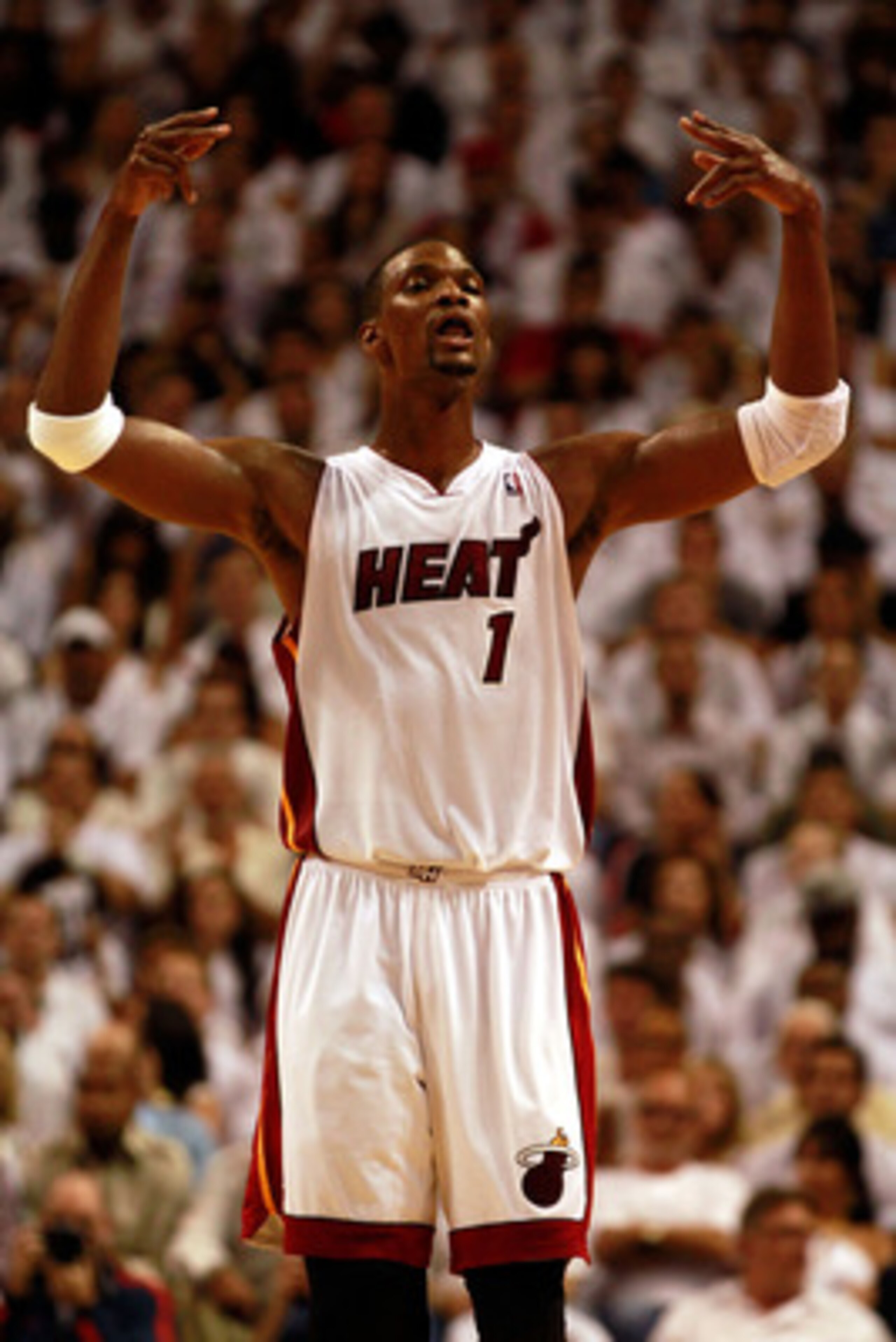 MIAMI, FL - MAY 24:  Chris Bosh #1 of the Miami Heat reacts against the Chicago Bulls in Game Four of the Eastern Conference Finals during the 2011 NBA Playoffs on May 24, 2011 at American Airlines Arena in Miami, Florida. NOTE TO USER: User expressly ack