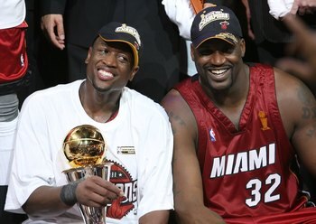 DALLAS - JUNE 20:  Series MVP Dwyane Wade #3 and Shaquille O'Neal #32 of the Miami Heat celebrate together after the Heat defeated the Dallas Mavericks in game six of the 2006 NBA Finals on June 20, 2006 at American Airlines Center in Dallas, Texas.  The 