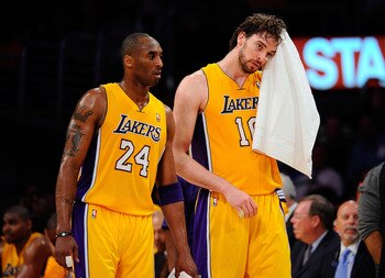 LOS ANGELES, CA - APRIL 20:  Kobe Bryant #24 and Pau Gasol #16 of the Los Angeles Lakers walk from the sideline while taking on the New Orleans Hornets in Game Two of the Western Conference Quarterfinals in the 2011 NBA Playoffs on April 20, 2011 at Stapl