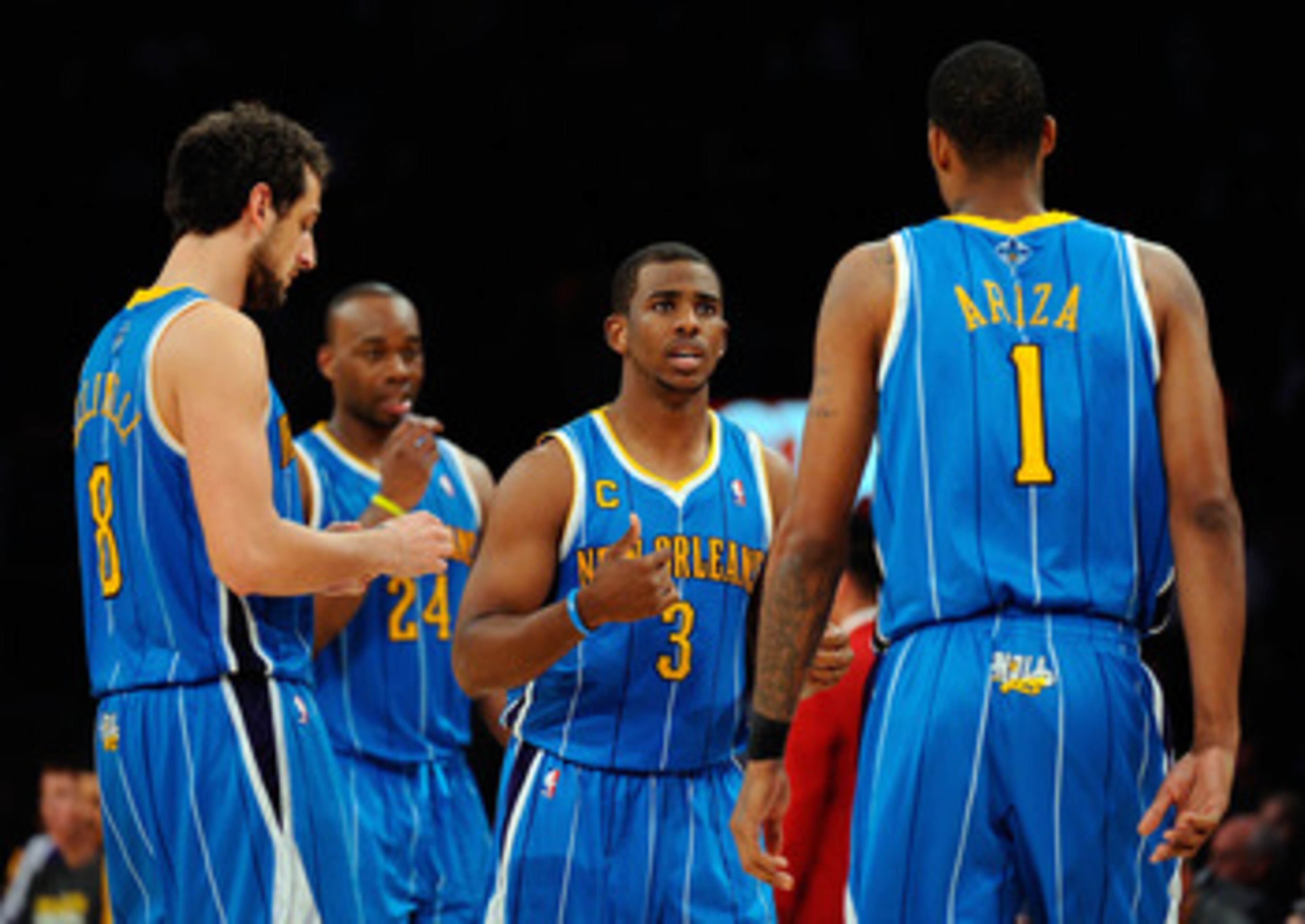 LOS ANGELES, CA - APRIL 20: (C) Chris Paul #3 of the New Orleans Hornets talks with teammates Marco Belinelli #8 and Trevor Ariza #1 while taking on the Los Angeles Lakers in Game Two of the Western Conference Quarterfinals in the 2011 NBA Playoffs on Ap LOS ANGELES, CA - APRIL 20: (C) Chris Paul #3 of the New Orleans Hornets talks with teammates Marco Belinelli #8 and Trevor Ariza #1 while taking on the Los Angeles Lakers in Game Two of the Western Conference Quarterfinals in the 2011 NBA Playoffs on Ap
