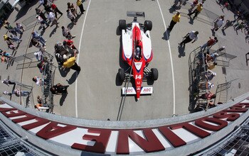 INDIANAPOLIS, IN - MAY 20:  Car #14, the ABC Supply Co A.J. Foyt Racing Dallara Honda driven by Vitor Meira of Brazil, leaves gasoline alley as it is towed toward pit lane during practice for the Indianapolis 500 on May 20, 2011 at Indianapolis Motor Spee