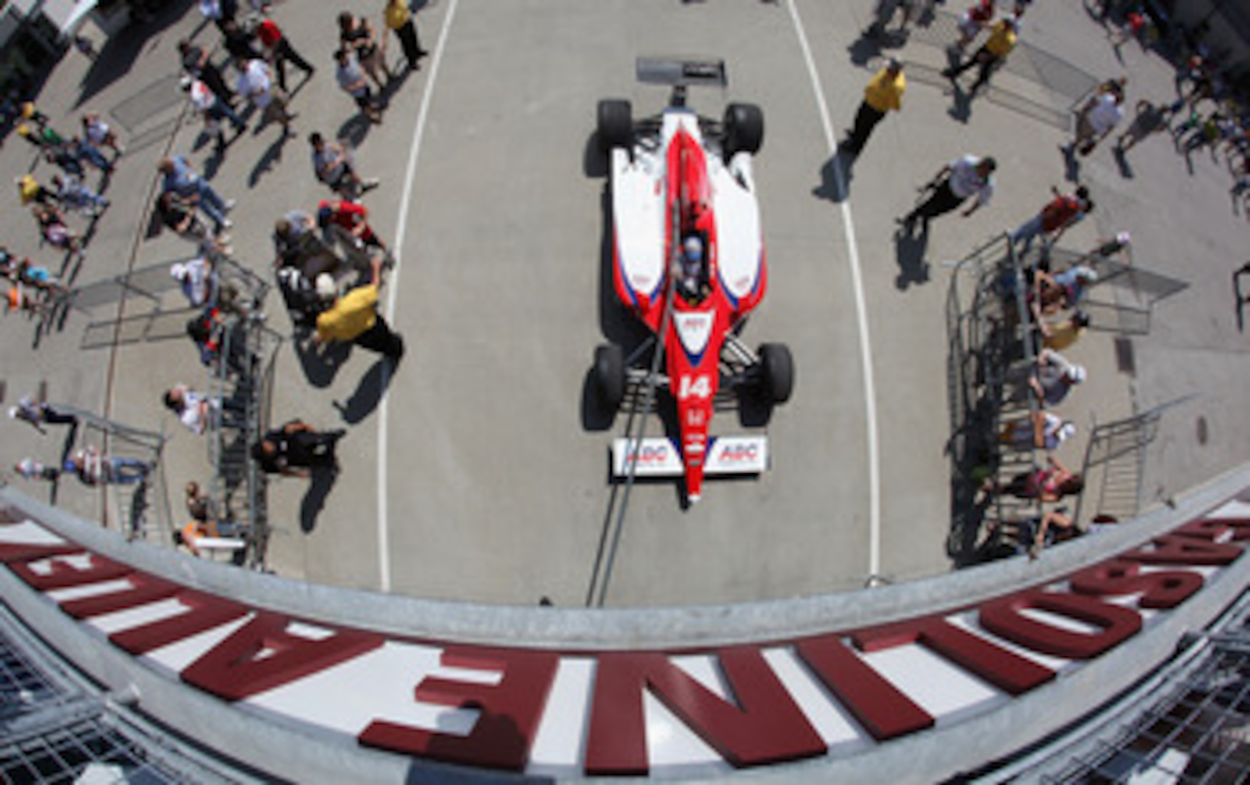 INDIANAPOLIS, IN - MAY 20:  Car #14, the ABC Supply Co A.J. Foyt Racing Dallara Honda driven by Vitor Meira of Brazil, leaves gasoline alley as it is towed toward pit lane during practice for the Indianapolis 500 on May 20, 2011 at Indianapolis Motor Spee