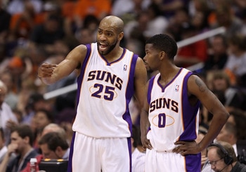 PHOENIX, AZ - MARCH 13:  Vince Carter #25 and Aaron Brooks #0 of the Phoenix Suns during the NBA game against the Orlando Magic at US Airways Center on March 13, 2011 in Phoenix, Arizona.  NOTE TO USER: User expressly acknowledges and agrees that, by down