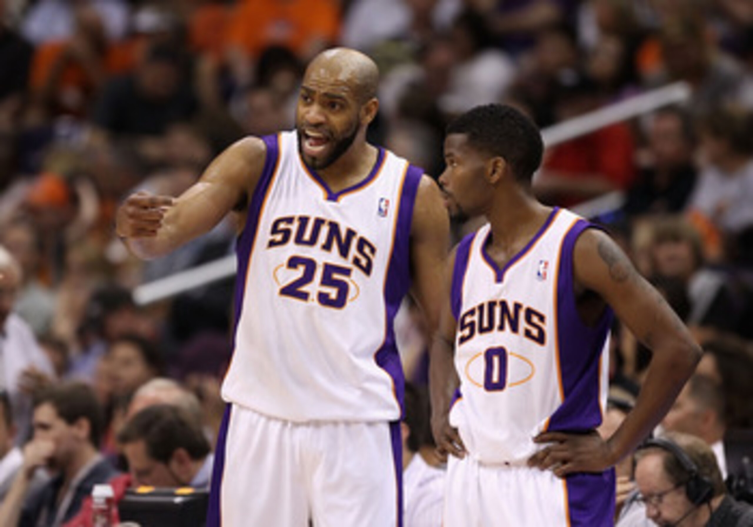 PHOENIX, AZ - MARCH 13:  Vince Carter #25 and Aaron Brooks #0 of the Phoenix Suns during the NBA game against the Orlando Magic at US Airways Center on March 13, 2011 in Phoenix, Arizona.  NOTE TO USER: User expressly acknowledges and agrees that, by down