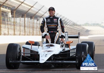 INDIANAPOLIS, IN - MAY 22:  Alex Tagliani of Canada, driver of the #77 Bowers & Wilkins/Sam Schmidt Motorsports Dallara Honda, poses on the finish line after qualifying on the pole for the Indianapolis 500 on May 22, 2011 at Indianapolis Motor Speedway in
