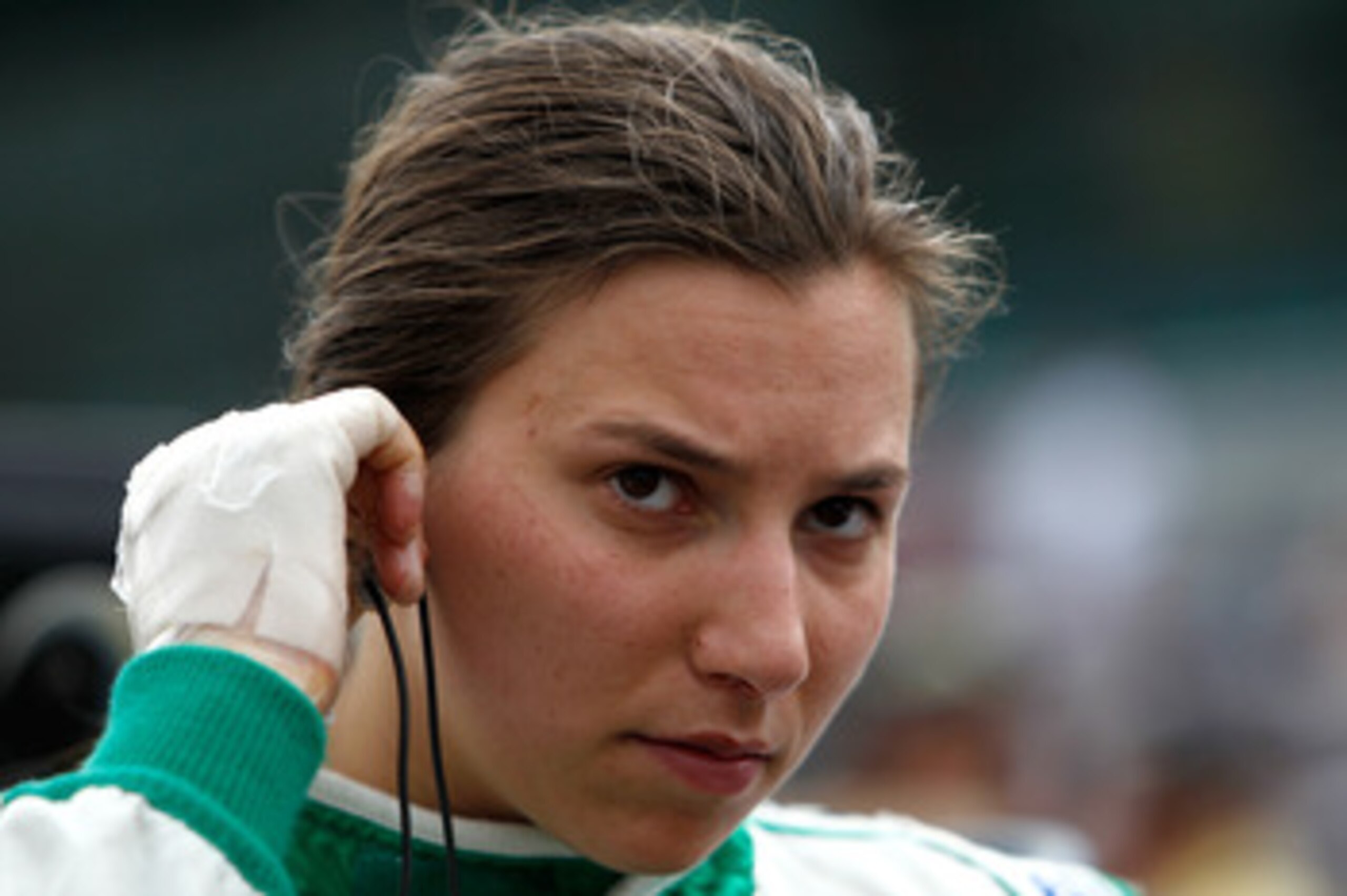INDIANAPOLIS - MAY 21:  Simona De Silvestro, with bandages on her hands after suffering burns from a crash, prepares to qualify her #78 Nuclear Clean Air Energy HVM Racing Dallara Honda for the 95th Indianapolis 500 Mile Race at the Indianapolis Motor Spe