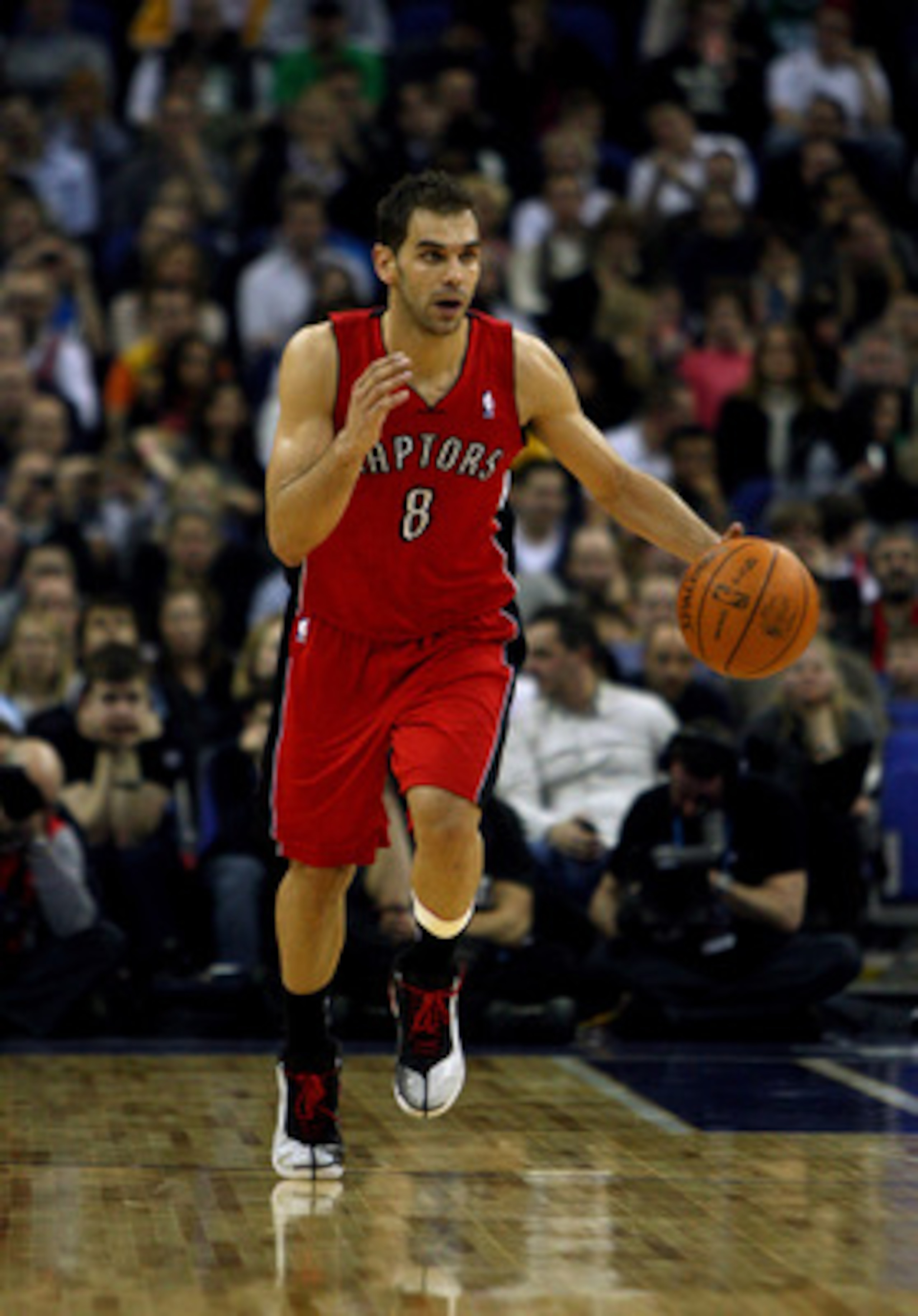 LONDON, ENGLAND - MARCH 04:  #8 Jose Calderon of the Raptors in action during the NBA match between New Jersey Nets and the Toronto Raptors at the O2 Arena on March 4, 2011 in London, England. NOTE TO USER: User expressly acknowledges and agrees that, by 