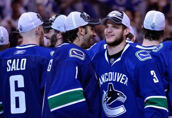 VANCOUVER, CANADA - MAY 24:  Goaltender Roberto Luongo #1 and Kevin Bieksa #3 of the Vancouver Canucks celebrate after defeating the San Jose Sharks 3-2 in double-overtime in Game Five to win the Western Conference Finals during the 2011 Stanley Cup Playo