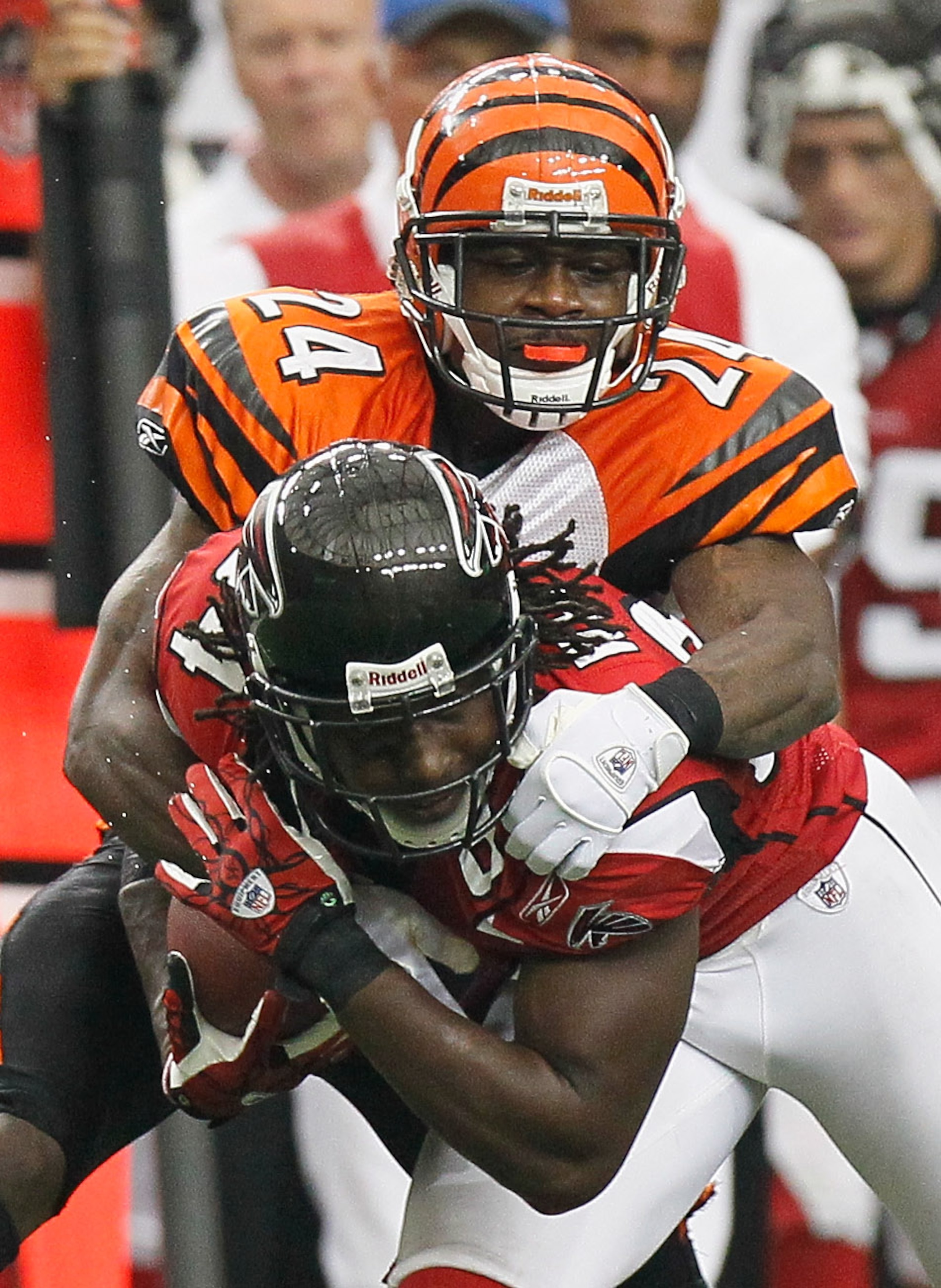 ATLANTA - OCTOBER 24:  Roddy White #84 of the Atlanta Falcons is tackled by Adam Jones #24 of the Cincinnati Bengals before having the ball stripped for a touchdown by Jones at Georgia Dome on October 24, 2010 in Atlanta, Georgia.  (Photo by Kevin C. Cox/