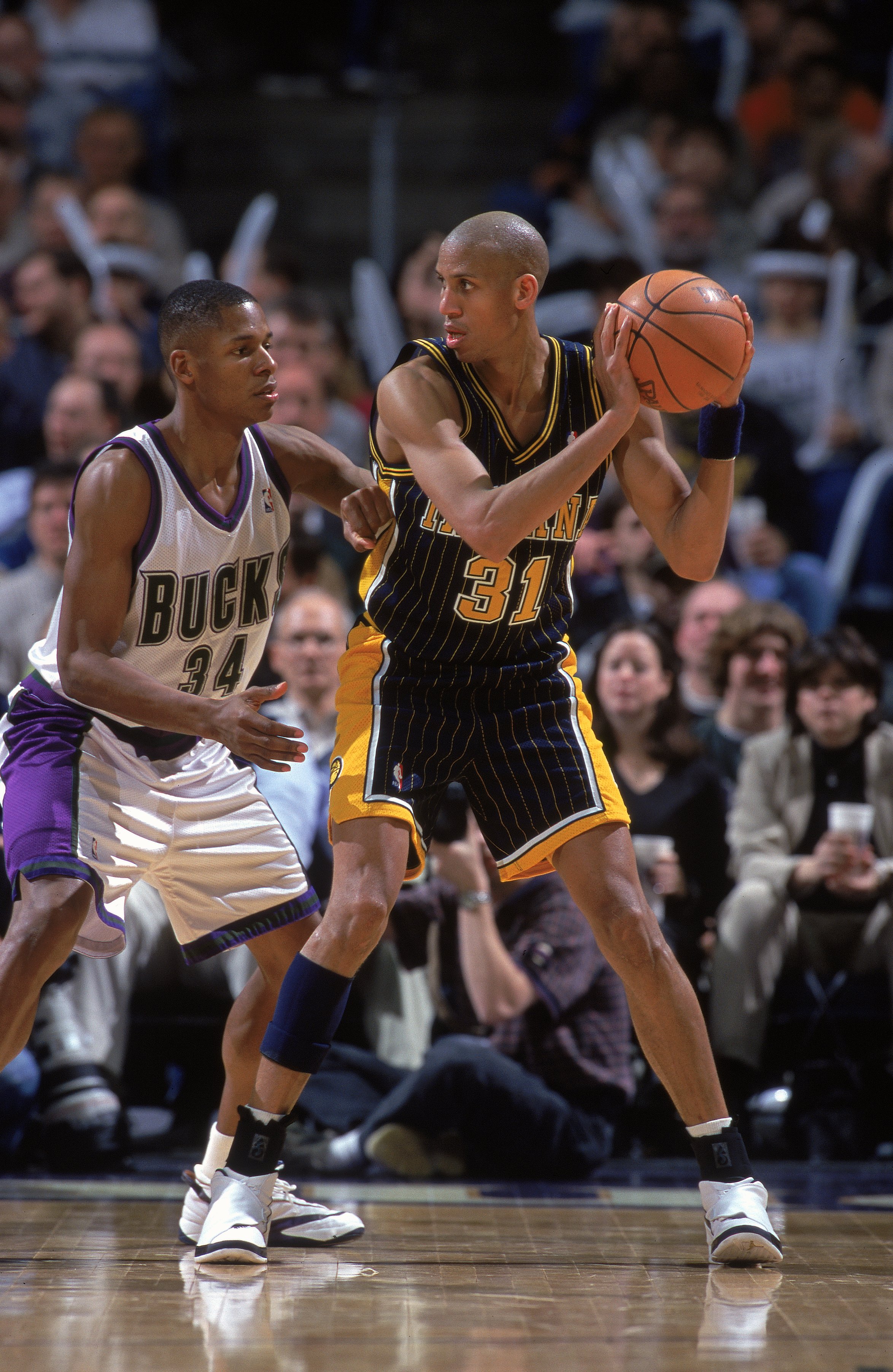17 Feb 2000: Reggie Miller #31 of the Indiana Pacers looks to pass the ball as he is guarded by Ray Allen #34 of the Milwaukee Bucks of the at the Bradley Center in Milwaukee, Wisconson. The Pacers defeated the Bucks 92-90. 17 Feb 2000: Reggie Miller #31 of the Indiana Pacers looks to pass the ball as he is guarded by Ray Allen #34 of the Milwaukee Bucks of the at the Bradley Center in Milwaukee, Wisconson. The Pacers defeated the Bucks 92-90.