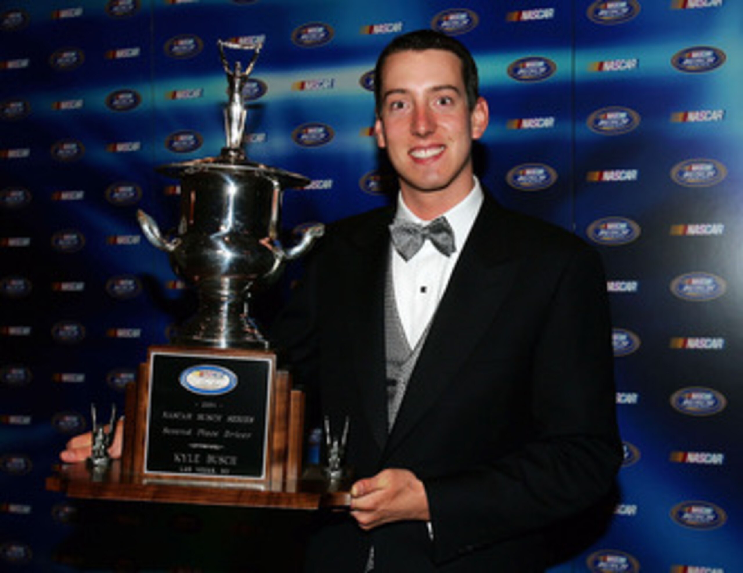 ORLANDO, FL - DECEMBER 10: Kyle Busch poses backstage with his trophy awarded for finishing second in the 2004 NASCAR Busch Series Top 10 at the 2004 NASCAR Busch Series Awards Ceremony at the Portofino Bay Hotel on December 10, 2004 in Orlando, Florida. ORLANDO, FL - DECEMBER 10: Kyle Busch poses backstage with his trophy awarded for finishing second in the 2004 NASCAR Busch Series Top 10 at the 2004 NASCAR Busch Series Awards Ceremony at the Portofino Bay Hotel on December 10, 2004 in Orlando, Florida.