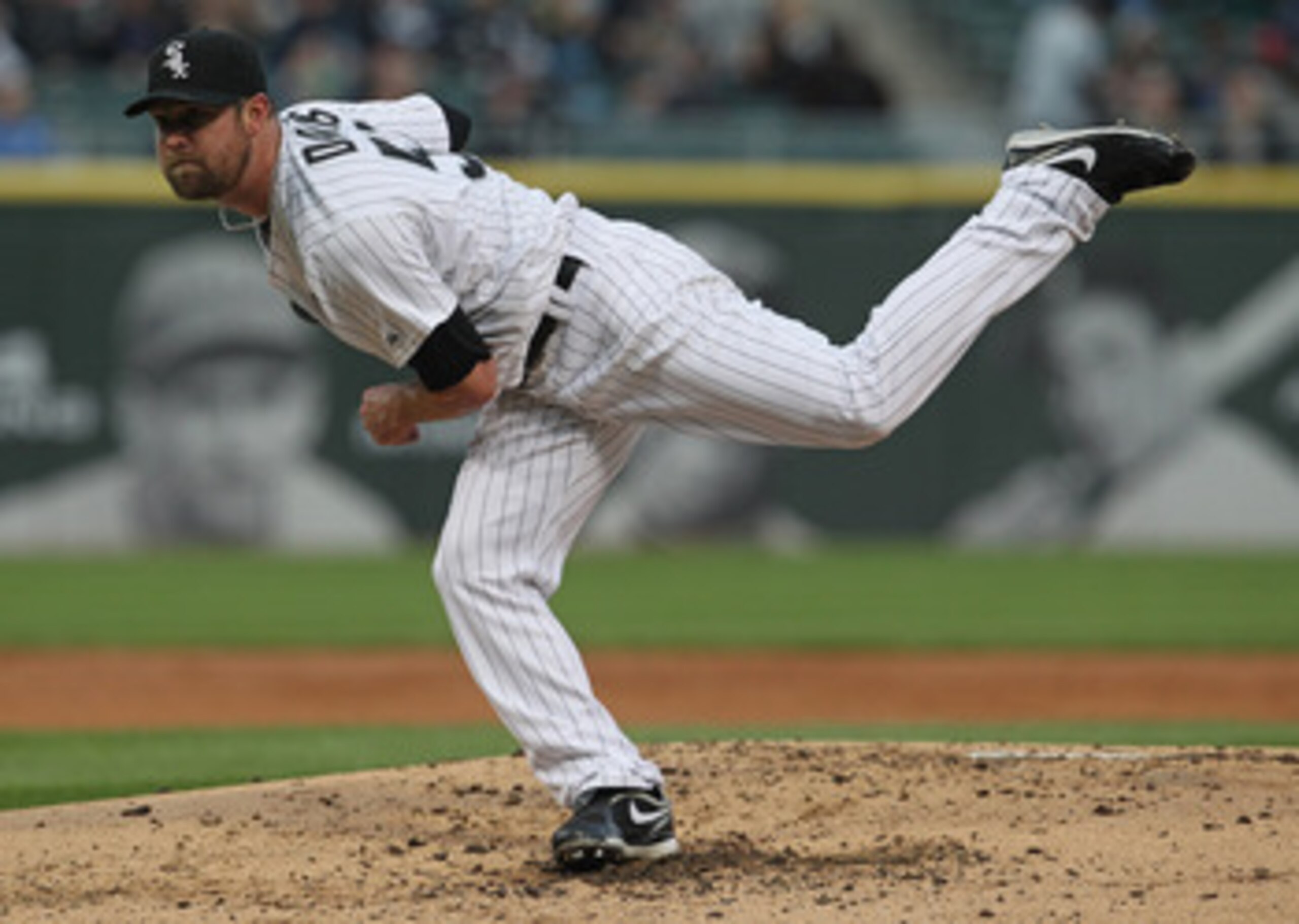 CHICAGO, IL - MAY 17: Starting pitcher John Danks #50 of the Chicago White Sox follows through after throwing a pitch against the Texas Rangers at U.S. Cellular Field on May 17, 2011 in Chicago, Illinois.  The White Sox defeated the Rangers 4-3. (Photo by