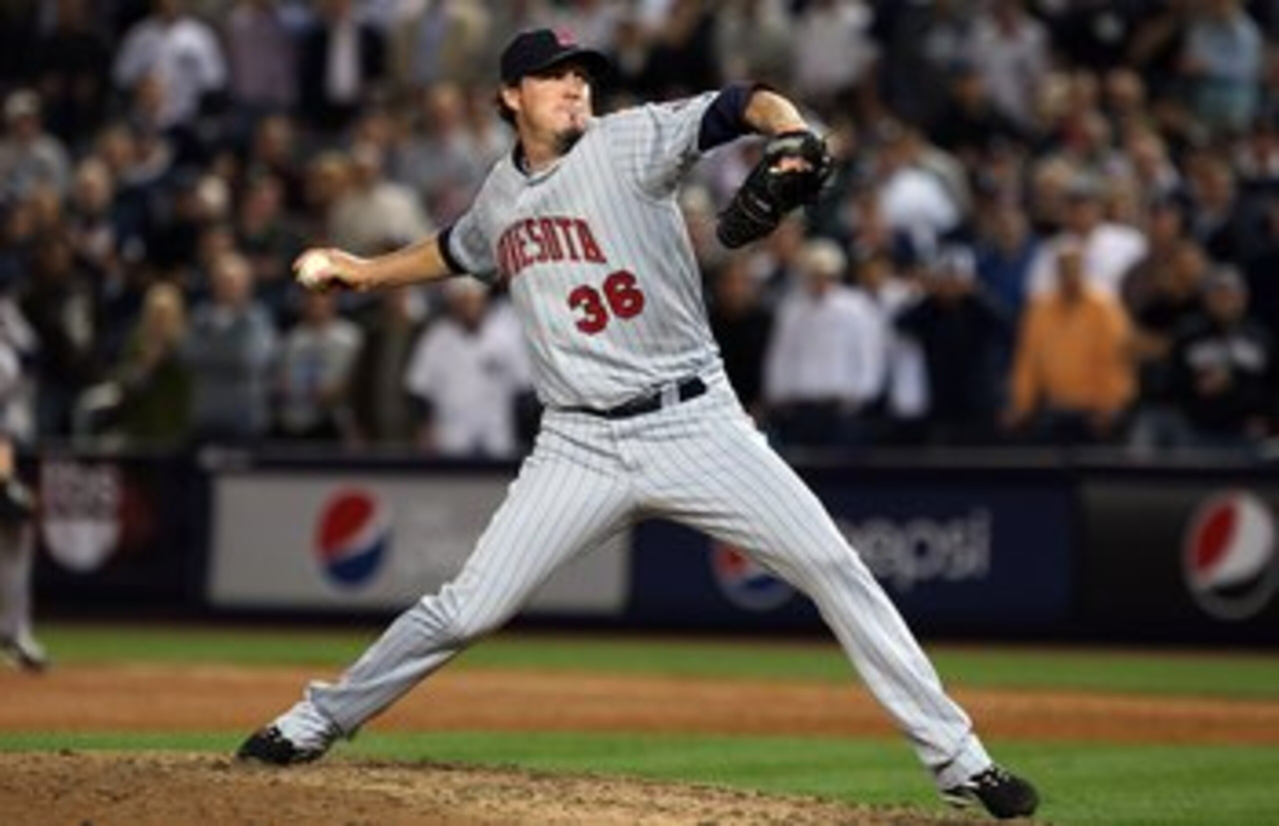 NEW YORK - OCTOBER 09: Joe Nathan #36 of the Minnesota Twins pitches against the New York Yankees in Game Two of the ALDS during the 2009 MLB Playoffs at Yankee Stadium on October 9, 2009 in the Bronx borough of New York City. (Photo by Jim McIsaac/Getty 