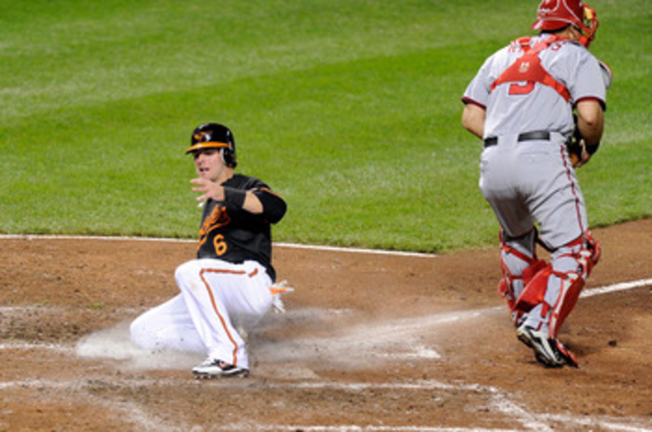 BALTIMORE, MD - MAY 20: Ryan Adams #6 of the Baltimore Orioles scores in the fourth inning against the Washington Nationals at Oriole Park at Camden Yards on May 20, 2011 in Baltimore, Maryland. Adams made his major league debut tonight. (Photo by Greg BALTIMORE, MD - MAY 20: Ryan Adams #6 of the Baltimore Orioles scores in the fourth inning against the Washington Nationals at Oriole Park at Camden Yards on May 20, 2011 in Baltimore, Maryland. Adams made his major league debut tonight. (Photo by Greg