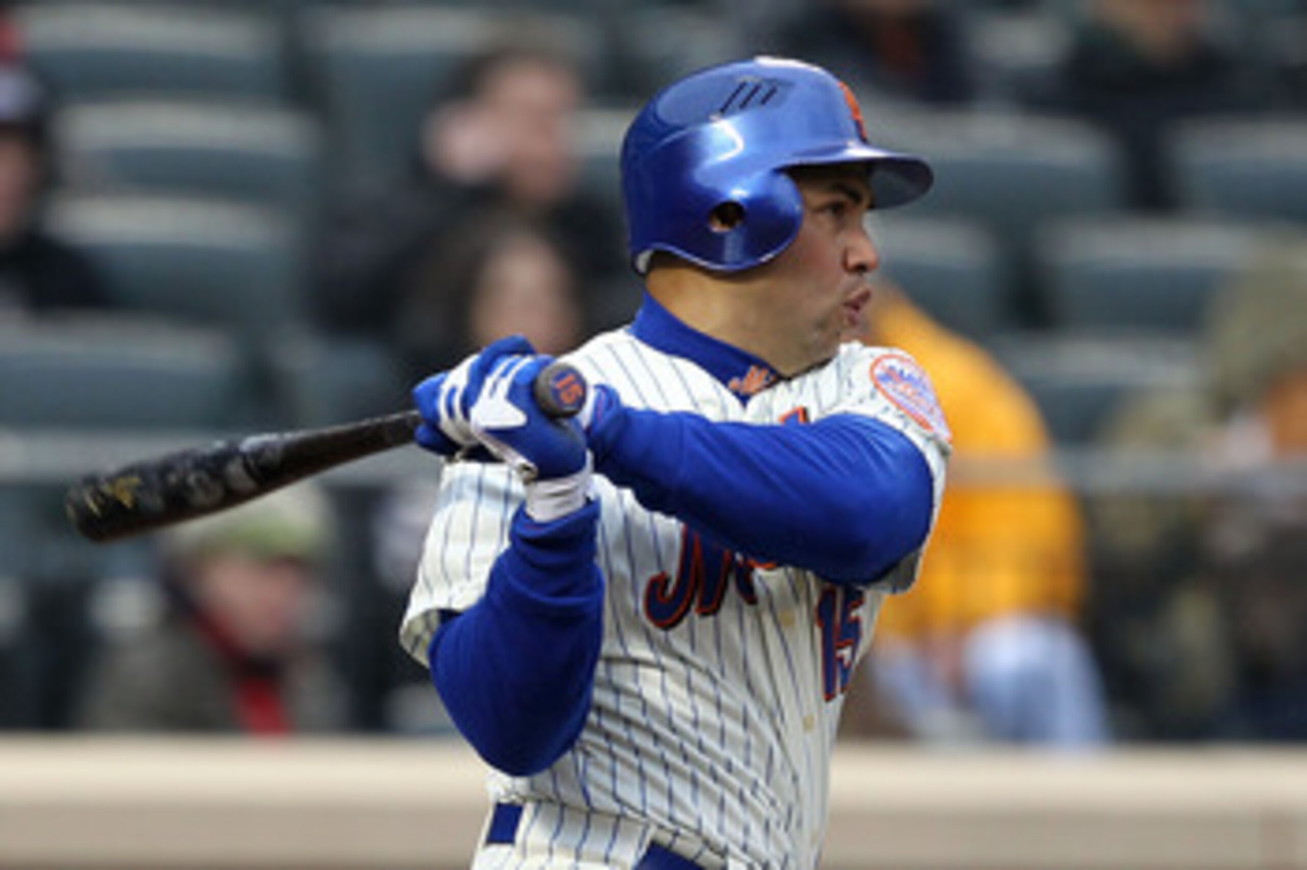 NEW YORK, NY - APRIL 08:  Carlos Beltran #15 of the New York Mets hits a double in the bottom of the sixth inning against the Washington Nationals during the Mets' Home Opener at Citi Field on April 8, 2011 in the Flushing neighborhood of Queens in New Yo
