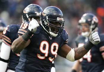 CHICAGO - DECEMBER 03:  Tank Johnson #99 of the Chicago Bears fires up the crowd during a game against the Minnesota Vikings on December 3, 2006 at Soldier Field in Chicago, Illinois. The Bears defeated the Vikings 23-13 to win the NFC North Division titl