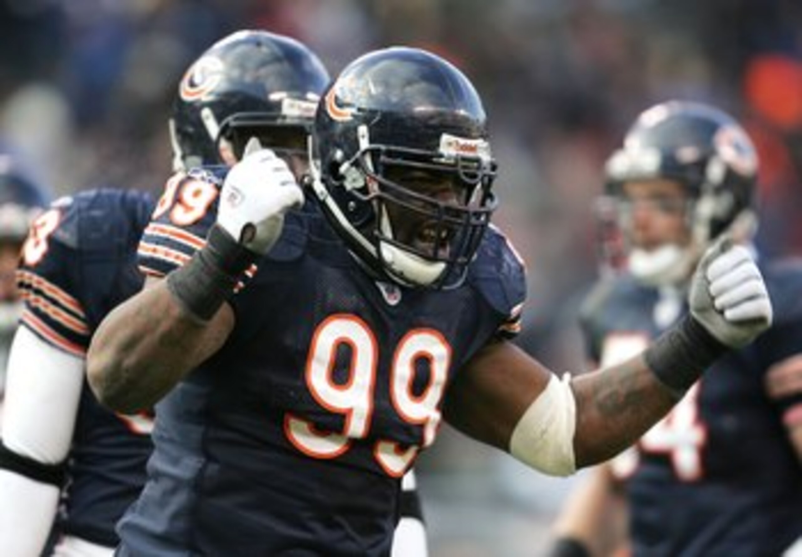 CHICAGO - DECEMBER 03: Tank Johnson #99 of the Chicago Bears fires up the crowd during a game against the Minnesota Vikings on December 3, 2006 at Soldier Field in Chicago, Illinois. The Bears defeated the Vikings 23-13 to win the NFC North Division titl CHICAGO - DECEMBER 03: Tank Johnson #99 of the Chicago Bears fires up the crowd during a game against the Minnesota Vikings on December 3, 2006 at Soldier Field in Chicago, Illinois. The Bears defeated the Vikings 23-13 to win the NFC North Division titl