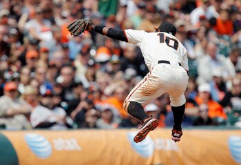 SAN FRANCISCO, CA - MAY 22: Miguel Tejada #10 of the San Francisco Giants leaps to catch a line-drive from Conor Jackson of the Oakland A's in the sixth inning at AT&T Park on May 22, 2011 in San Francisco, California. The Giants won 5-4 in 11 innings. (P