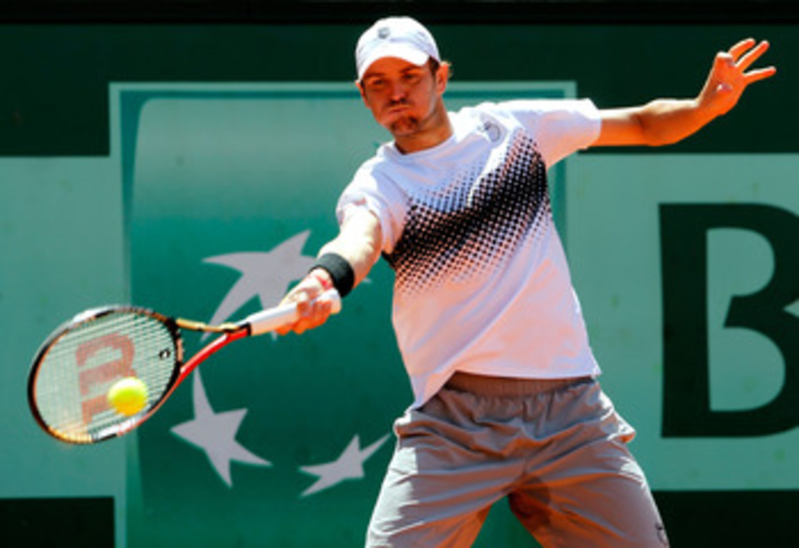PARIS, FRANCE - MAY 23:  Mardy Fish of USA plays a forehand during the men's singles first round match between Mardy Fish of USA and Ricardo Mello of Brazil on day two of the French Open at Roland Garros on May 23, 2011 in Paris, France.  (Photo by Matthe