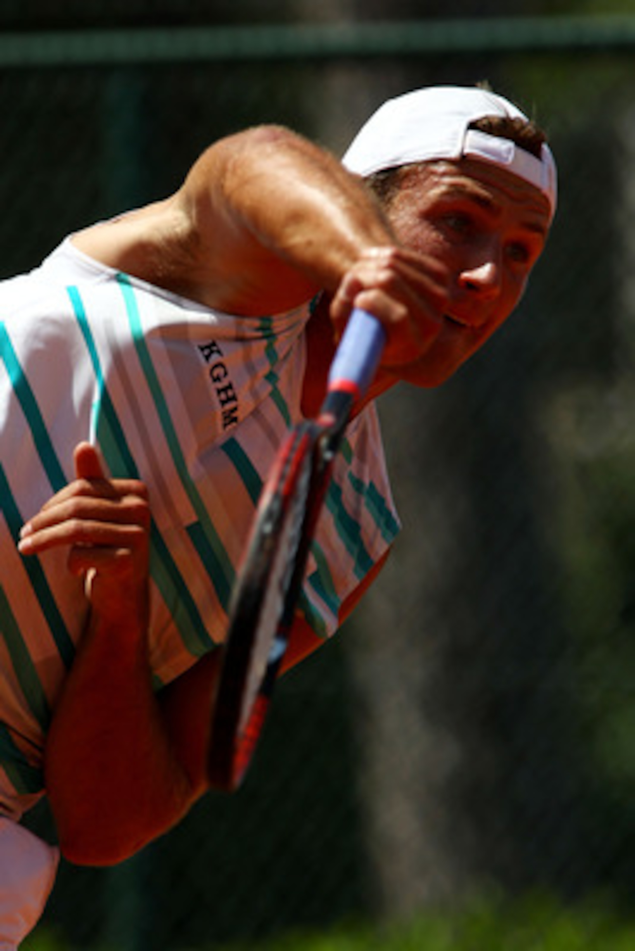PARIS, FRANCE - MAY 24:  Lukasz Kubot of Poland serves during the men's singles round one match between Nicolas Almagro of Spain and Lukasz Kubot of Poland on day three of the French Open at Roland Garros on May 24, 2011 in Paris, France.  (Photo by Alex 