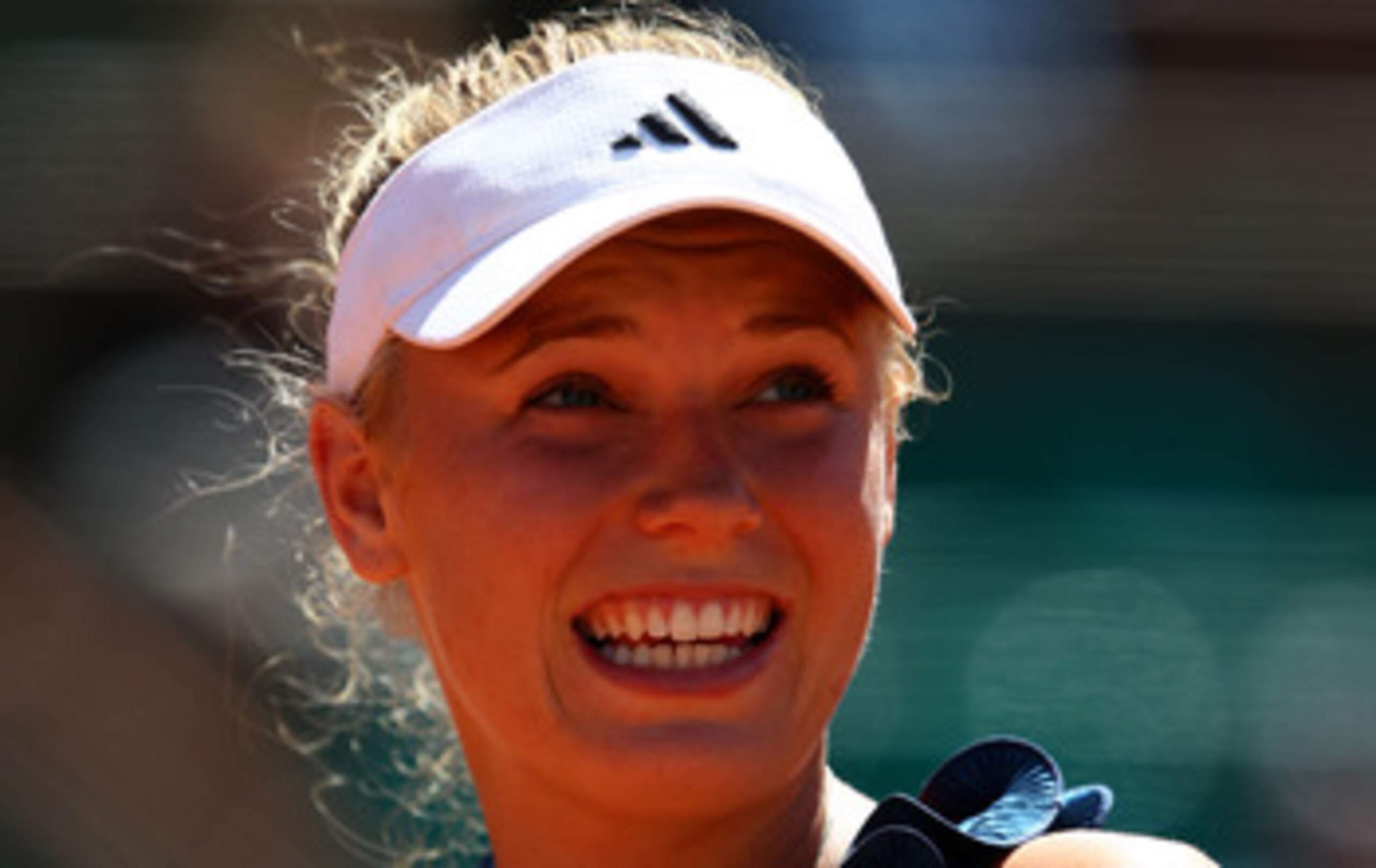 PARIS, FRANCE - MAY 25:  Caroline Wozniacki of Denmark hits a forehand during the women's singles round two match between Caroline Wozniacki of Denmark and Aleksandra Wozniak of Canada on day four of the French Open at Roland Garros on May 25, 2011 in Par