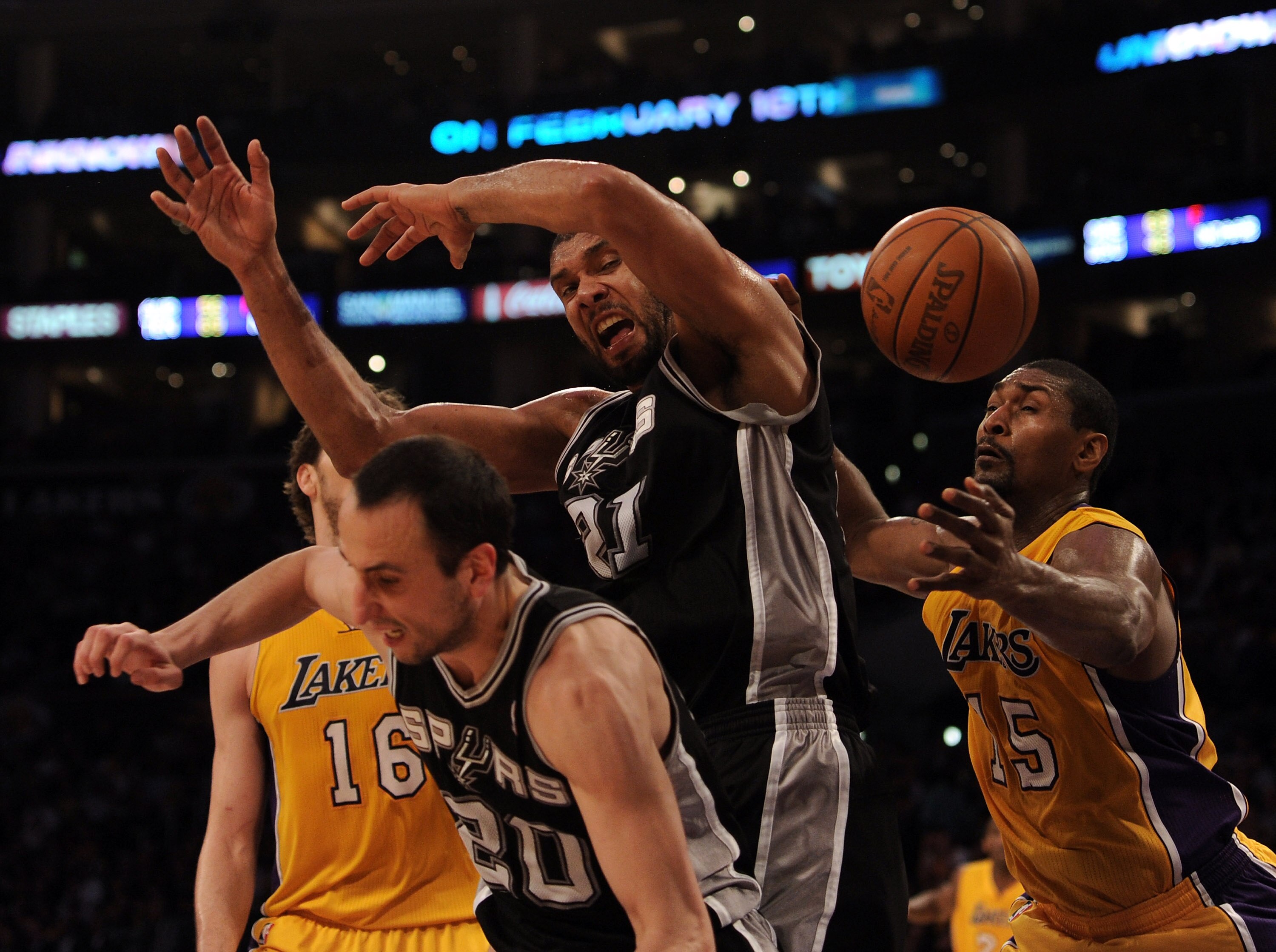 LOS ANGELES, CA - FEBRUARY 03:  Tim Duncan #21 of the San Antonio Spurs has the ball knocked away by Ron Artest #15 of the Los Angeles Lakers as Manu Ginobili #20 and Pau Gasol #16 look for a rebound during the first half at Staples Center on February 3,
