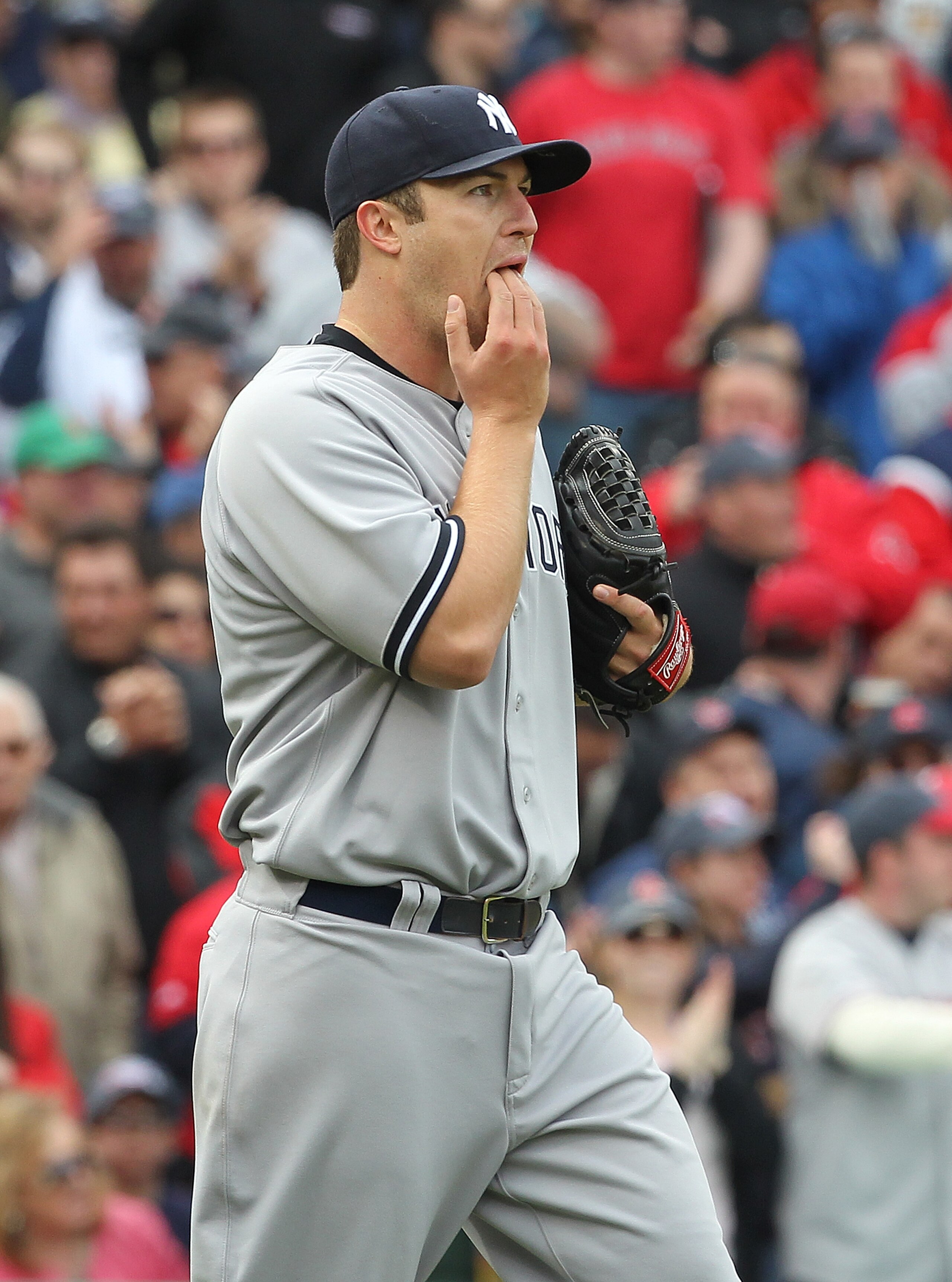 BOSTON, MA - APRIL 8:  Phil Hughes #65 of  the New York Yankees reacts during a rough second inning against the Boston Red Sox on Opening Day at Fenway Park on April 8, 2011 in Boston, Massachusetts. (Photo by Jim Rogash/Getty Images)