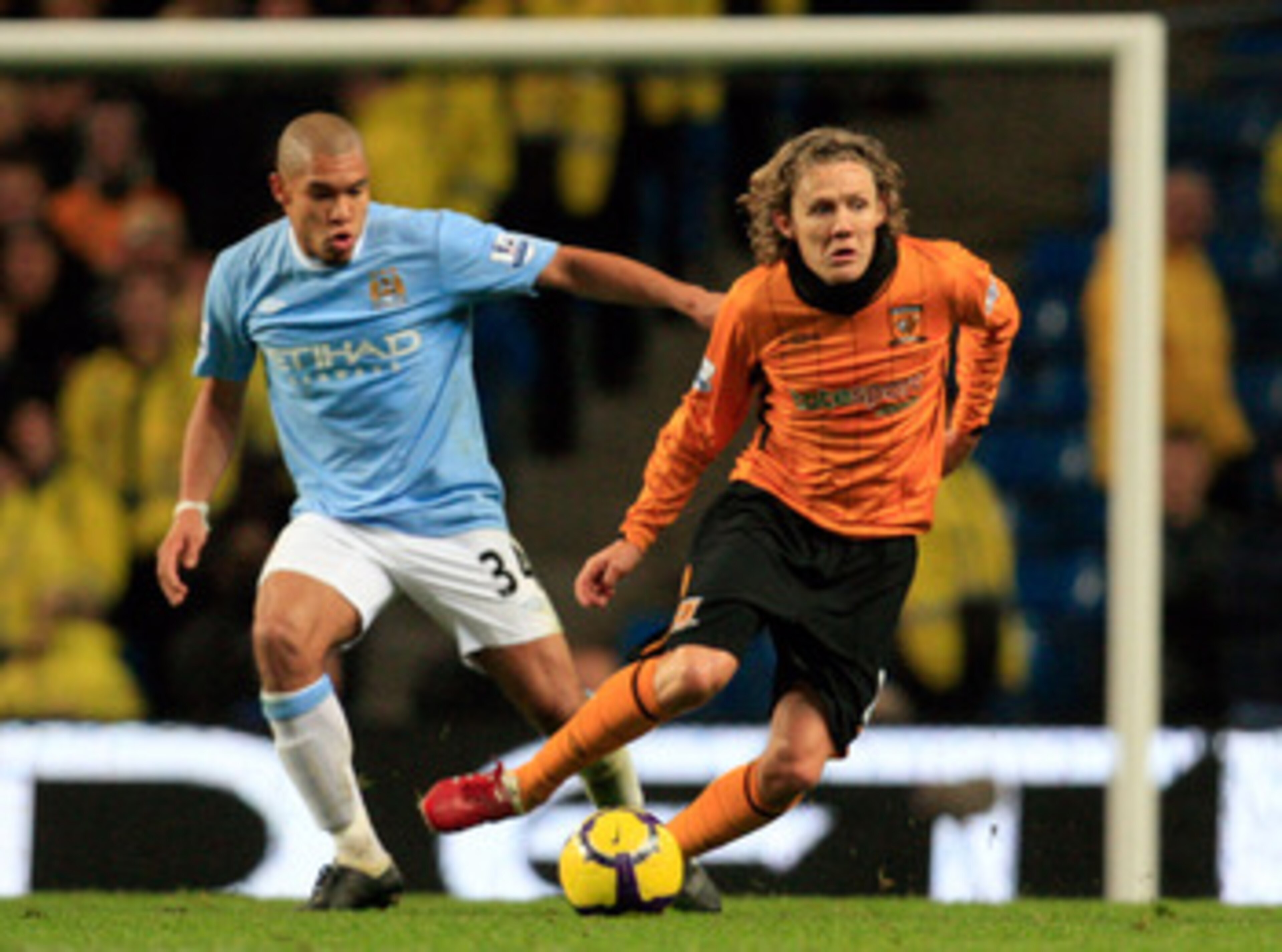 MANCHESTER, ENGLAND - NOVEMBER 28: Nigel de Jong of Manchester City follows Jimmy Bullard of Hull City during the Barclays Premier League match between Manchester City and Hull City at the City of Manchester Stadium on November 28, 2009 in Manchester, Eng