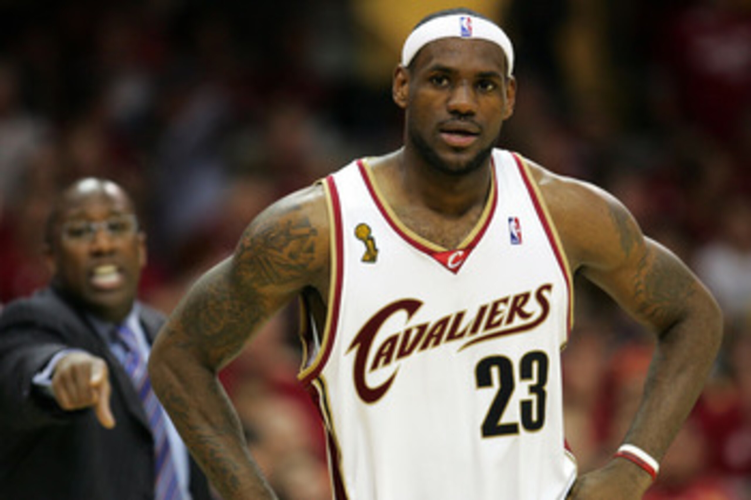 CLEVELAND - JUNE 14: LeBron James #23 of the Cleveland Cavaliers pauses during a timeout as Head Coach Mike Brown shouts directions from the bench in Game Four of the NBA Finals on June 14, 2007 at the Quicken Loans Arena in Cleveland, Ohio. NOTE TO USER: CLEVELAND - JUNE 14: LeBron James #23 of the Cleveland Cavaliers pauses during a timeout as Head Coach Mike Brown shouts directions from the bench in Game Four of the NBA Finals on June 14, 2007 at the Quicken Loans Arena in Cleveland, Ohio. NOTE TO USER: