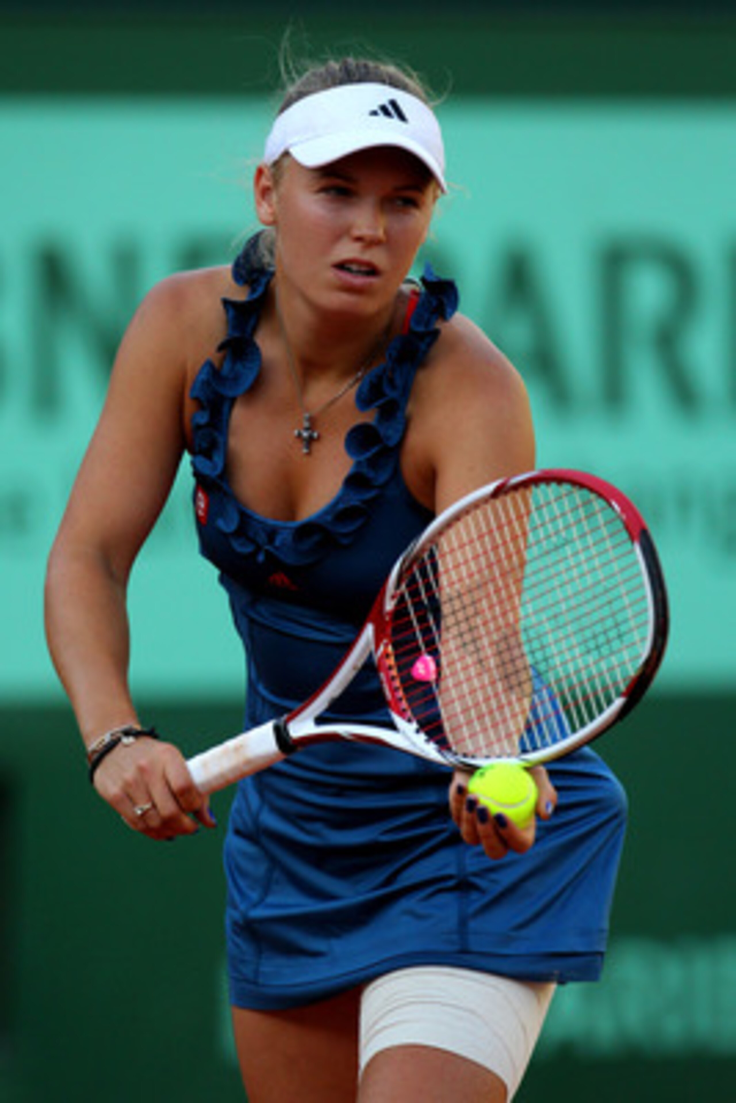 PARIS, FRANCE - MAY 23:  Caroline Wozniacki of Denmark serves during the women's singles round one match between Caroline Wozniacki of Denmark and Kimiko Date-Krumm of Japan on day two of the French Open at Roland Garros on May 23, 2011 in Paris, France. 