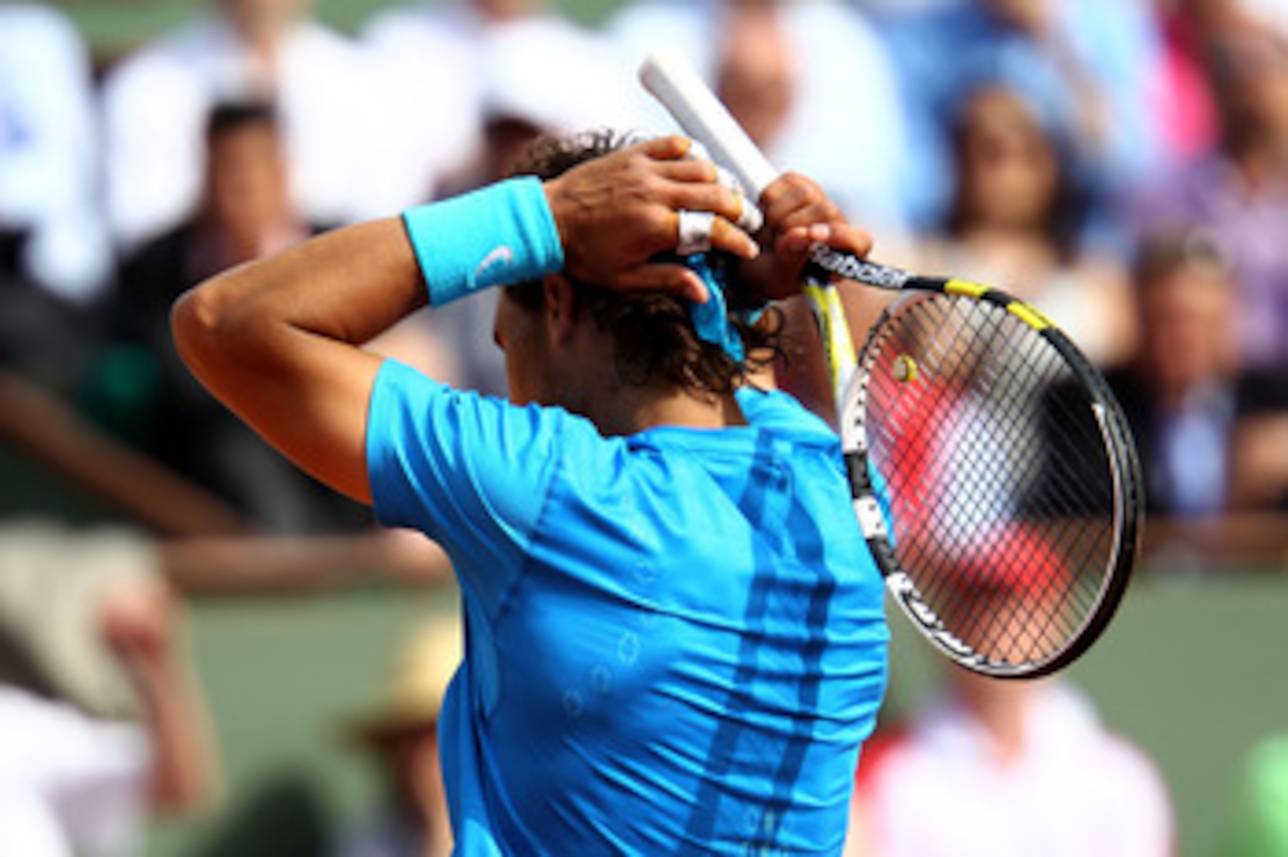PARIS, FRANCE - MAY 24:  Rafael Nadal of Spain shows his dejection during the men's singles round one match between Rafael Nadal of Spain and John Isner of USA on day three of the French Open at Roland Garros on May 24, 2011 in Paris, France.  (Photo by C