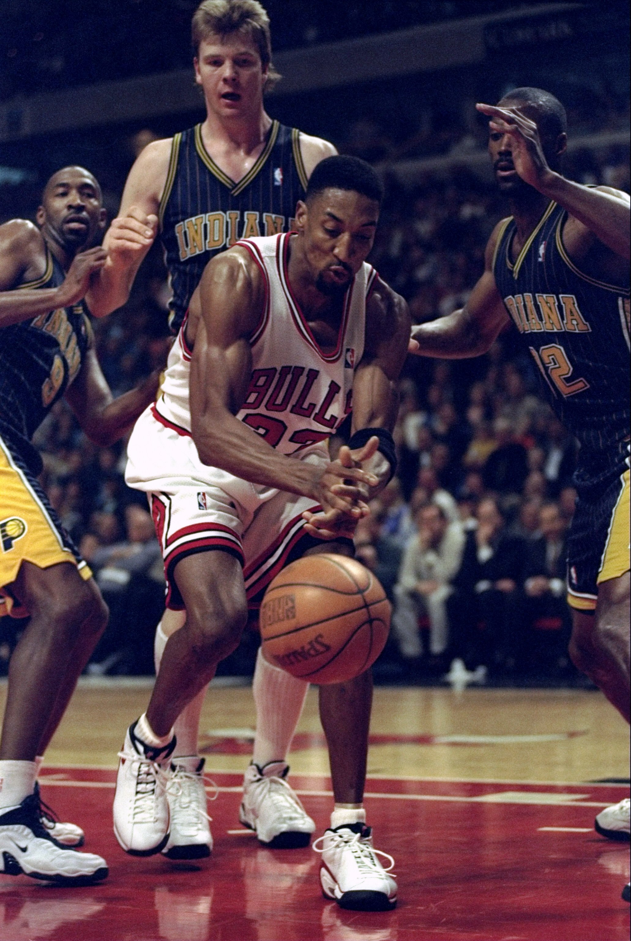 13 Apr 1998:  Scottie Pippen #33 of the Chicago Bulls is guarded by Dale Davis (L), Rik Smits #45 (C), and Derrick McKey (R) of the Indiana Pacers during a game at the United Center in Chicago, Illinois. The Pacers defeated the Bulls 114-105. Mandatory Cr